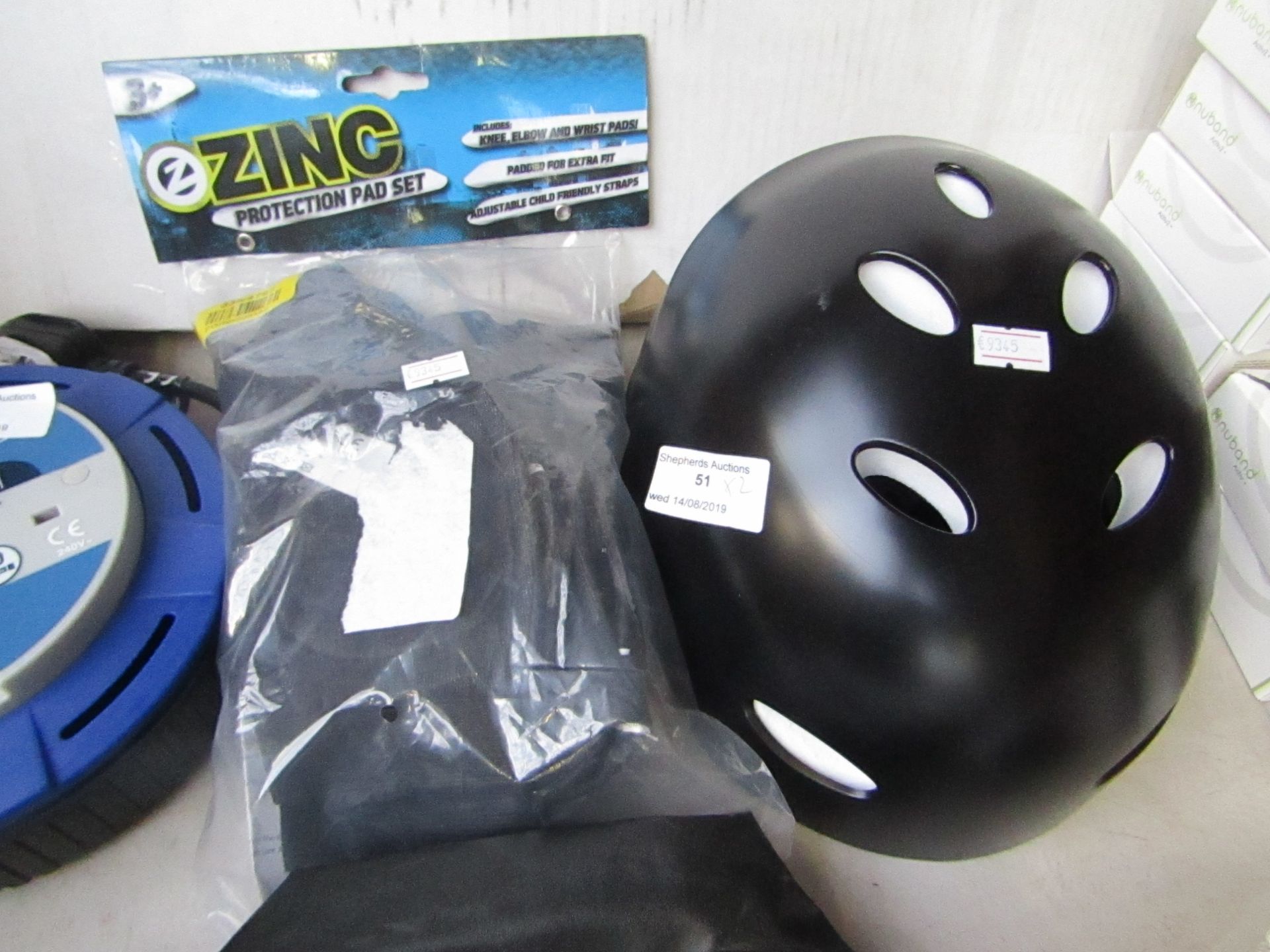 Zinc protection pad set with a cycle helmet, one is packaged.