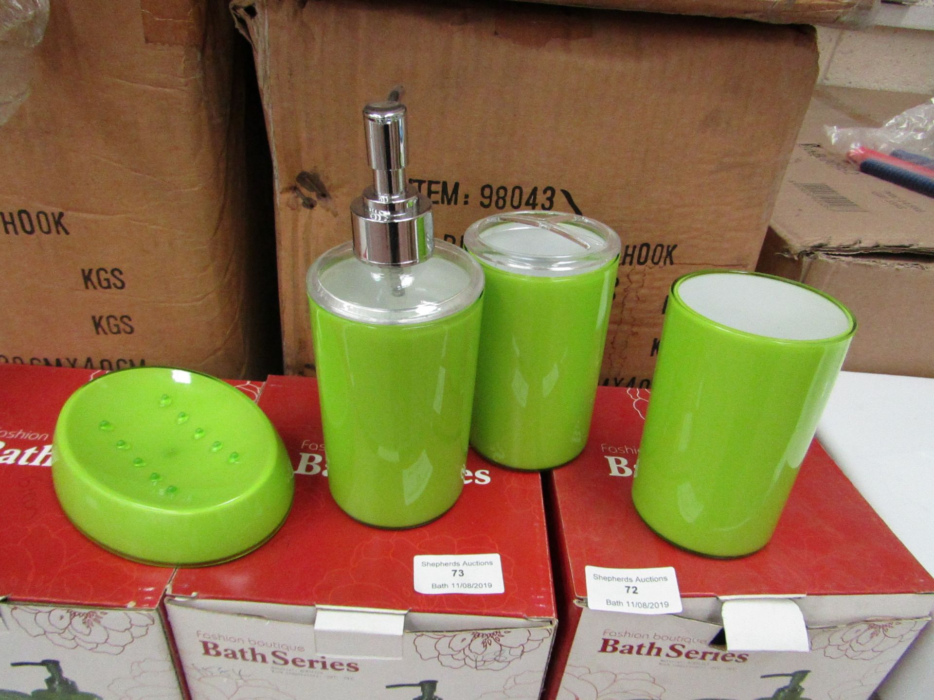 Lime Green bathroom set that includes soap dish, beaker, toothbrush holder and lotion dispenser, all