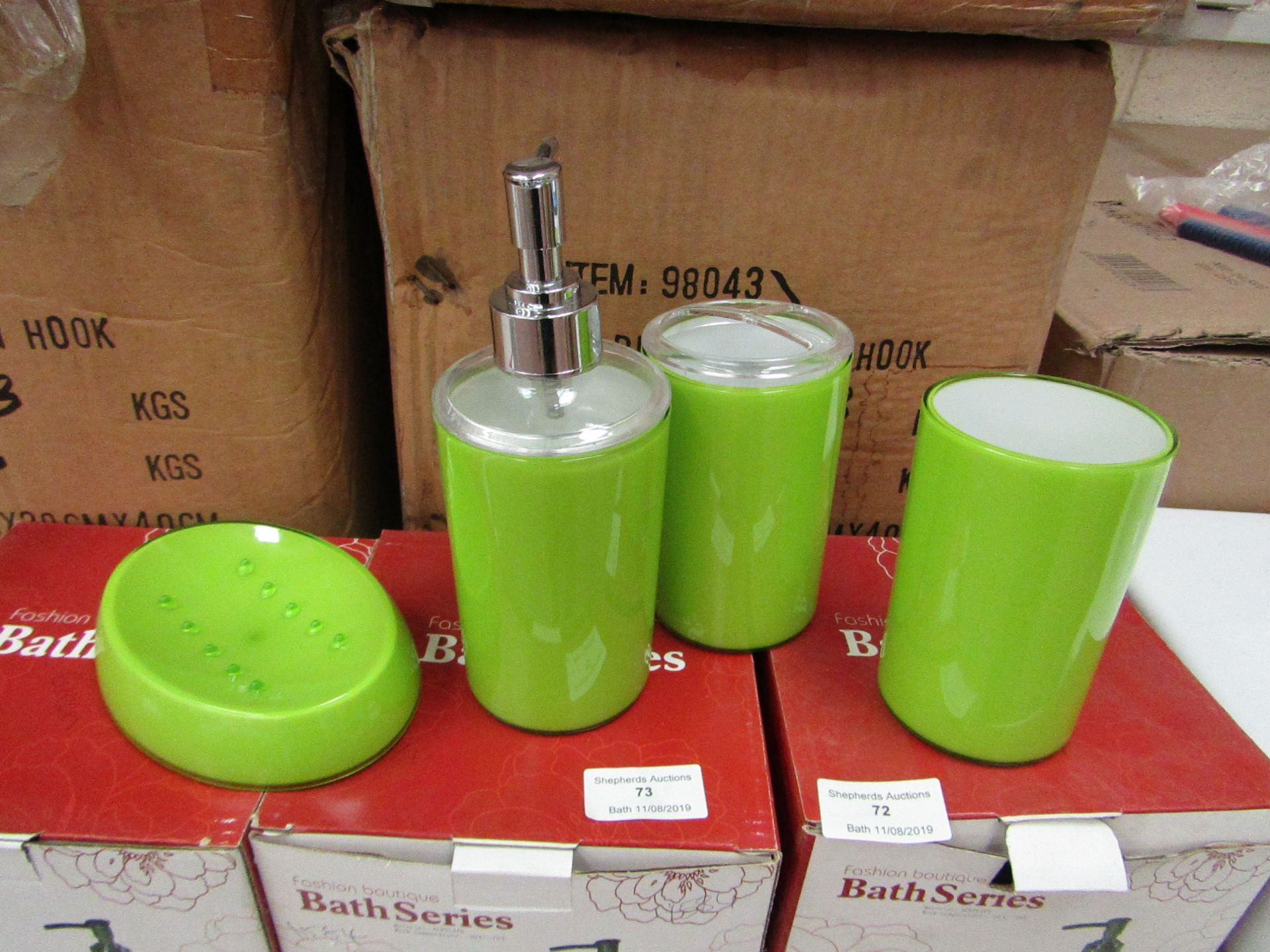 Lime Green bathroom set that includes soap dish, beaker, toothbrush holder and lotion dispenser, all