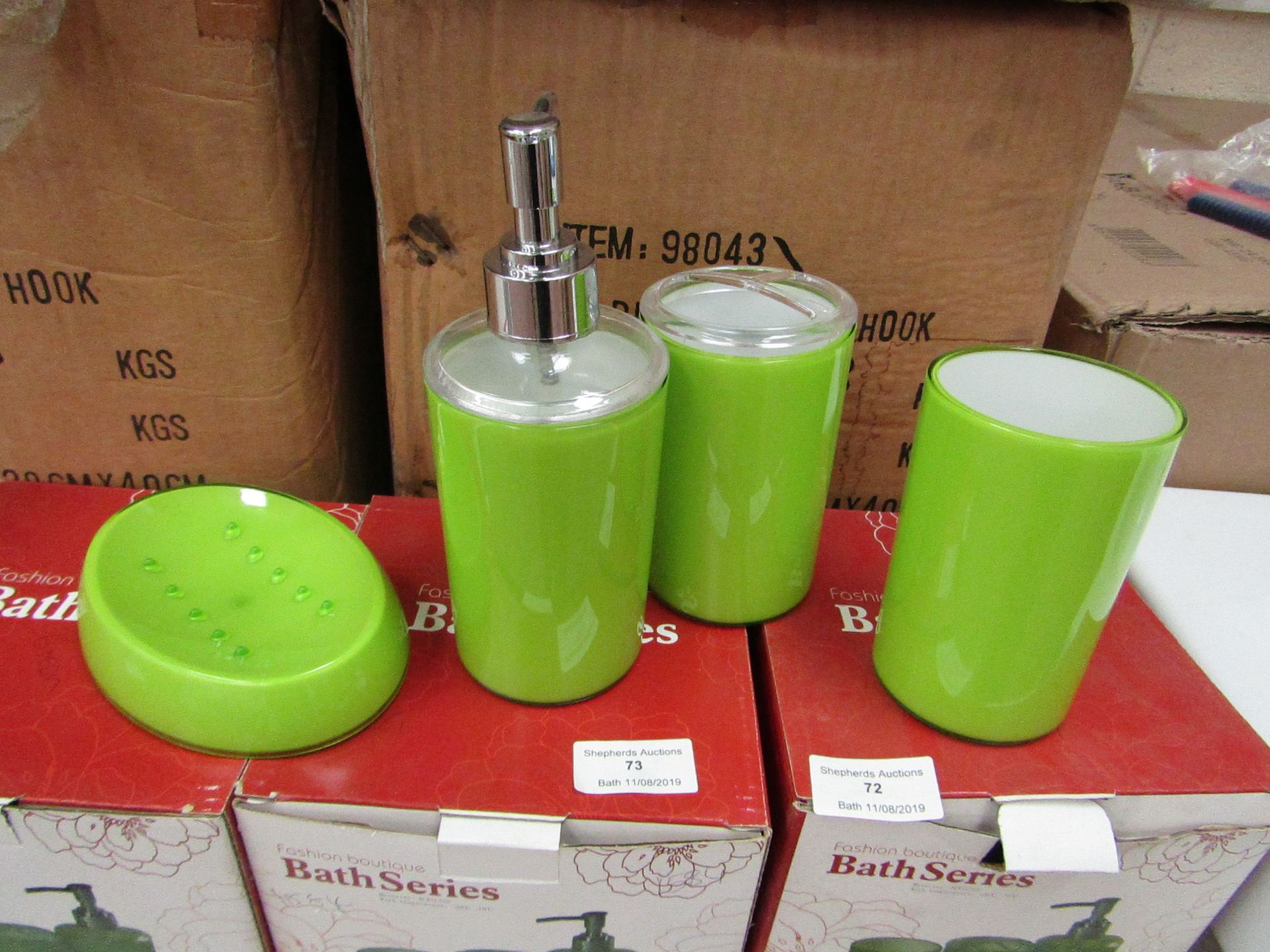 Lime Green bathroom set that includes soap dish, beaker, toothbrush holder and lotion dispenser, all