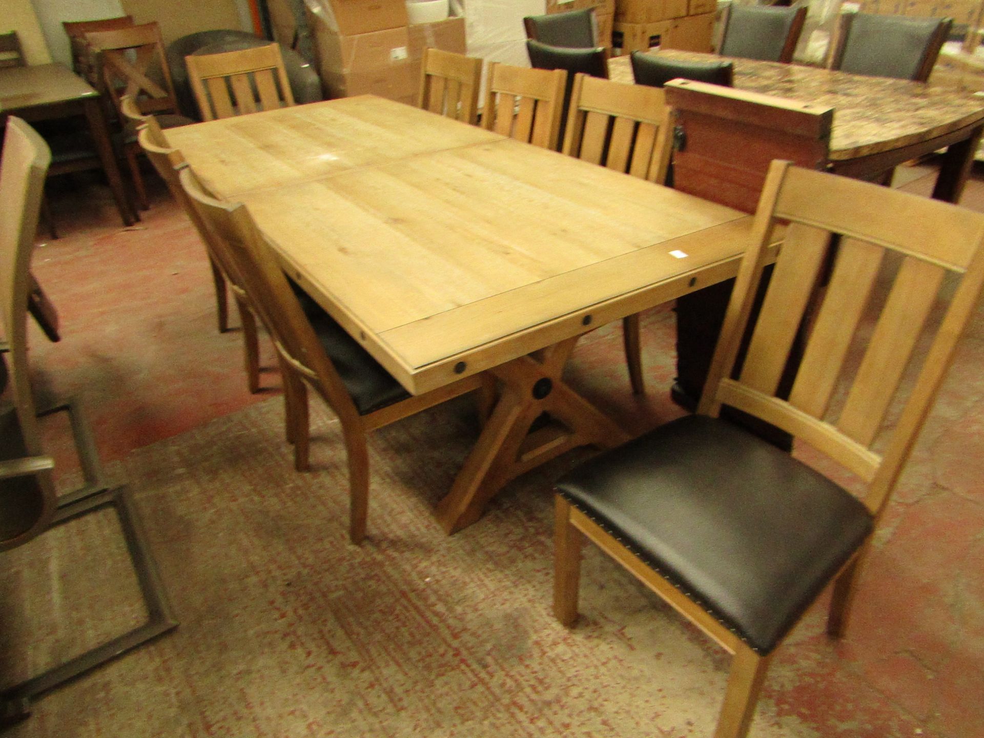 Chattanoga extending 8 seater dinign table with 8 dining chairs, RRP £1499, some marks down one edge
