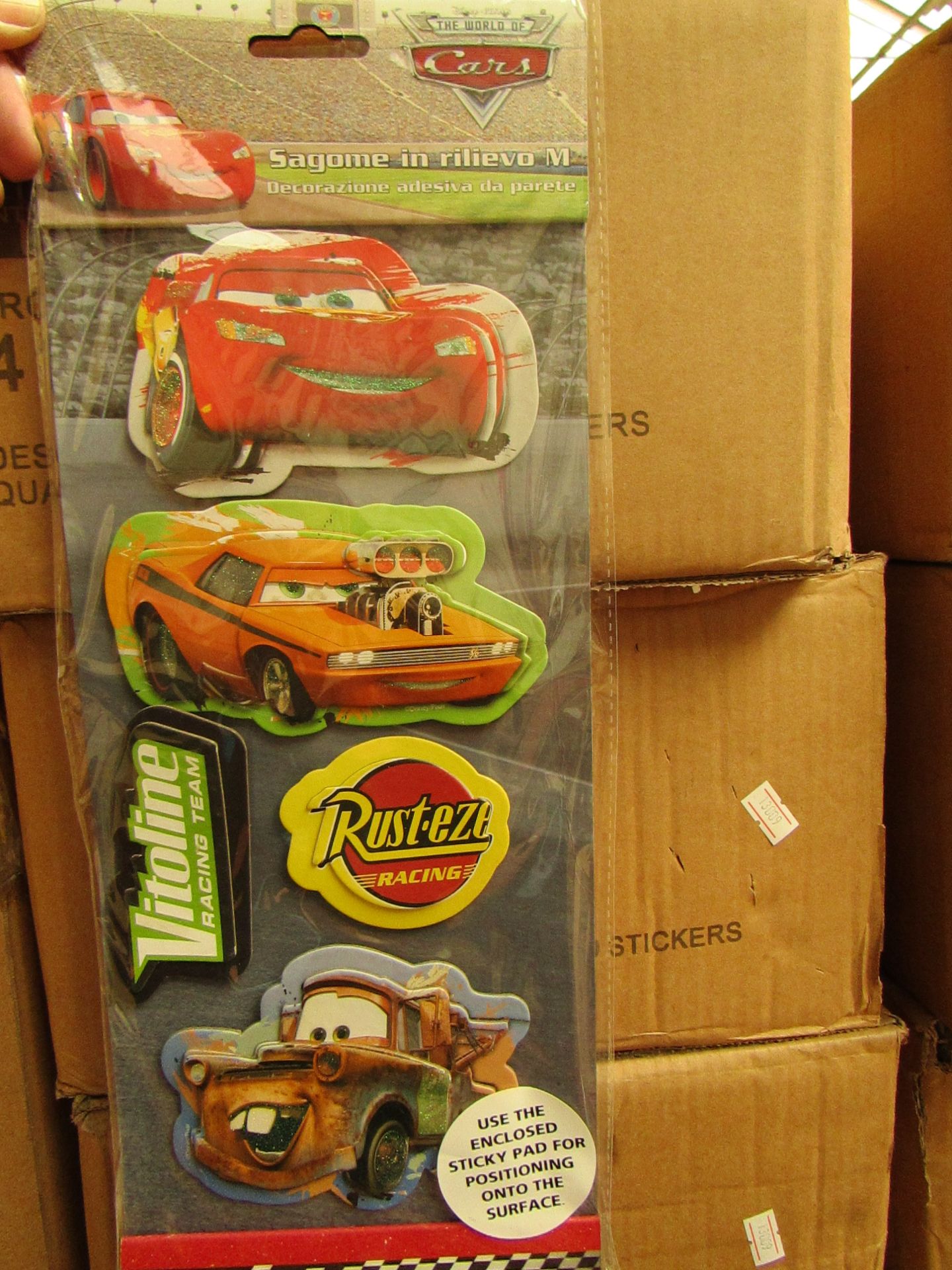 box  of 48 packs of Cars 2 3D Sticker Sets packaged