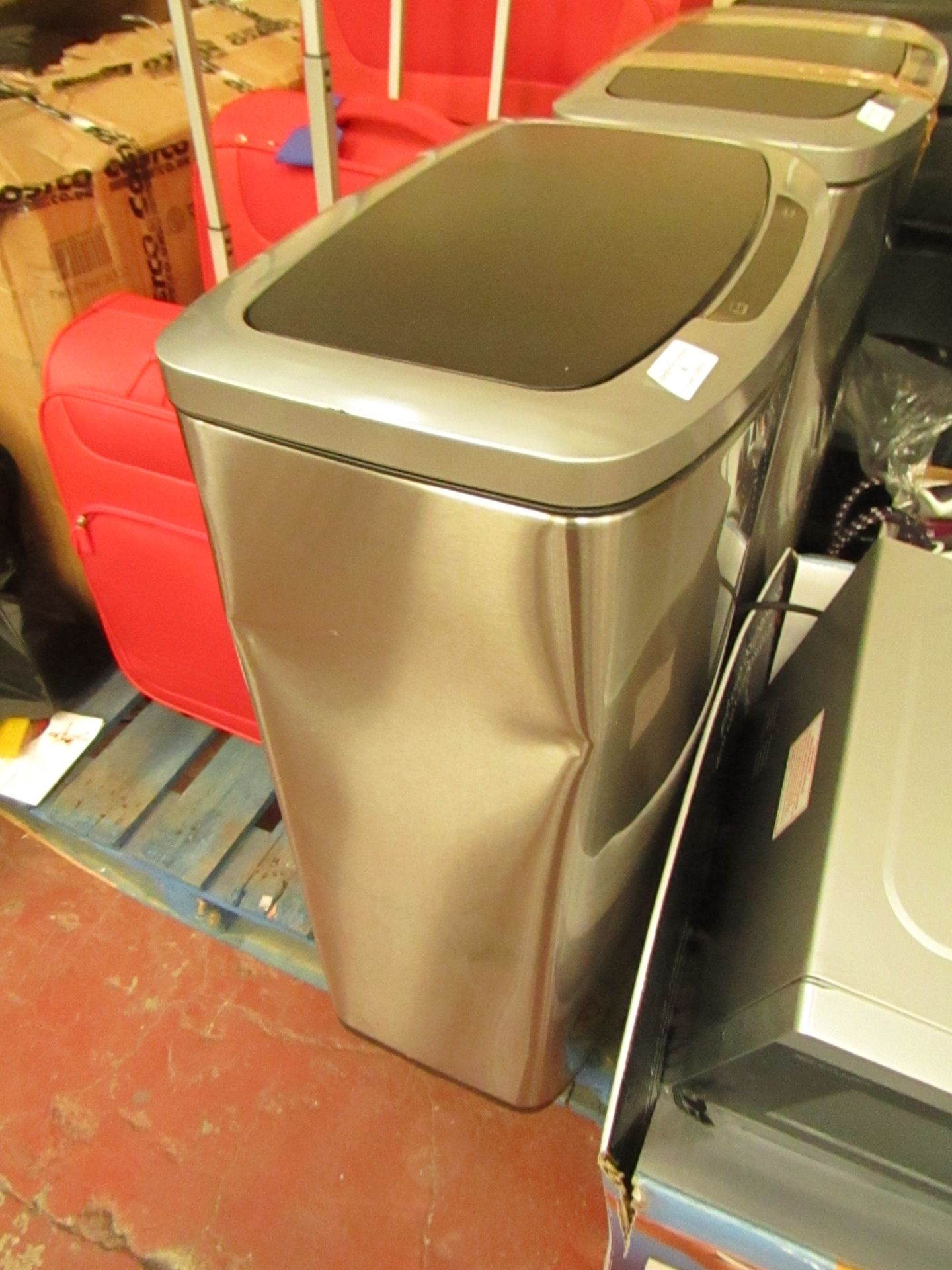 Large automatic sensor opening bin, dented on the side.