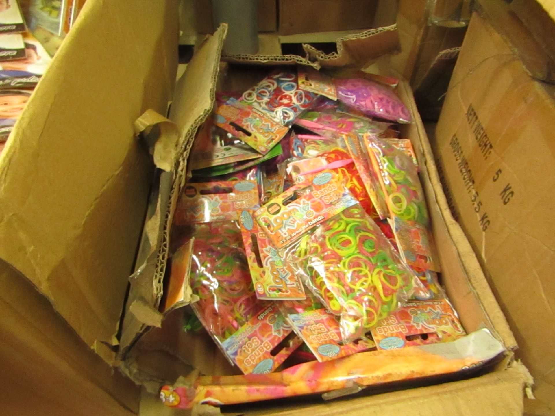 Approx 25 Packs of 300 Loom Bands.Packaged
