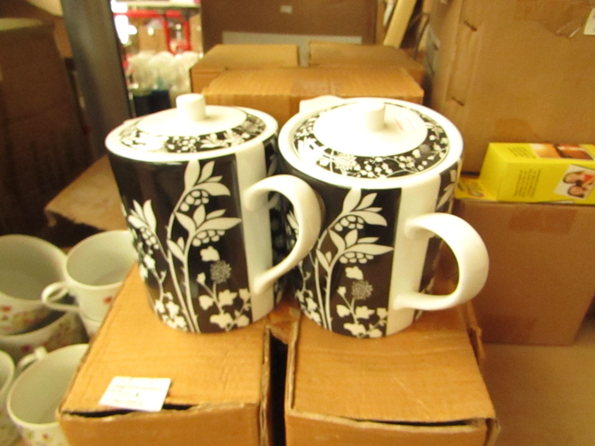 8 X Black/White Teapots & 6 Small floral patterned cups, all boxed