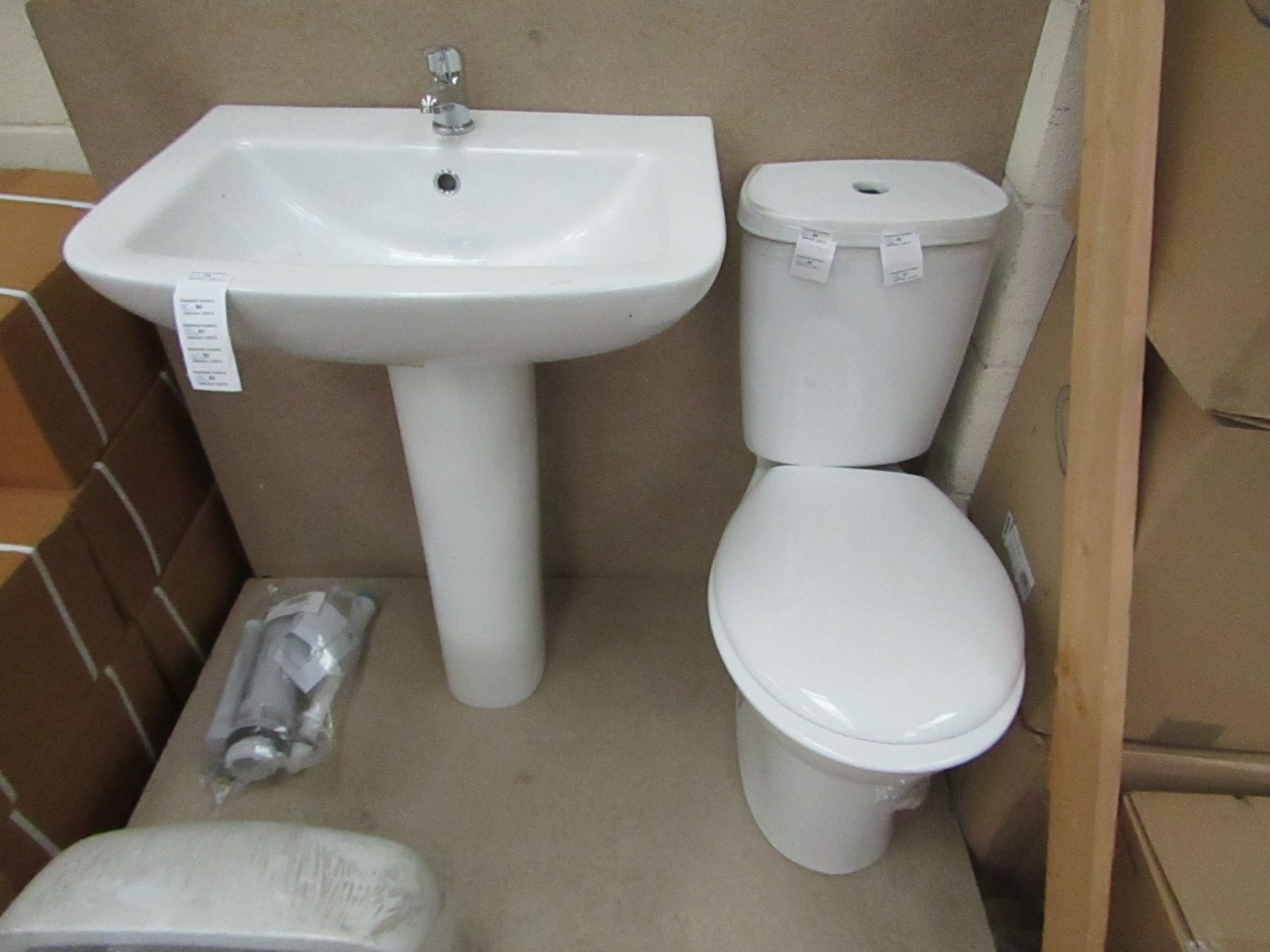 Unbranded Roca Cloakroom set that includes close coupled toilet with pan cistern, seat, flush kit, a