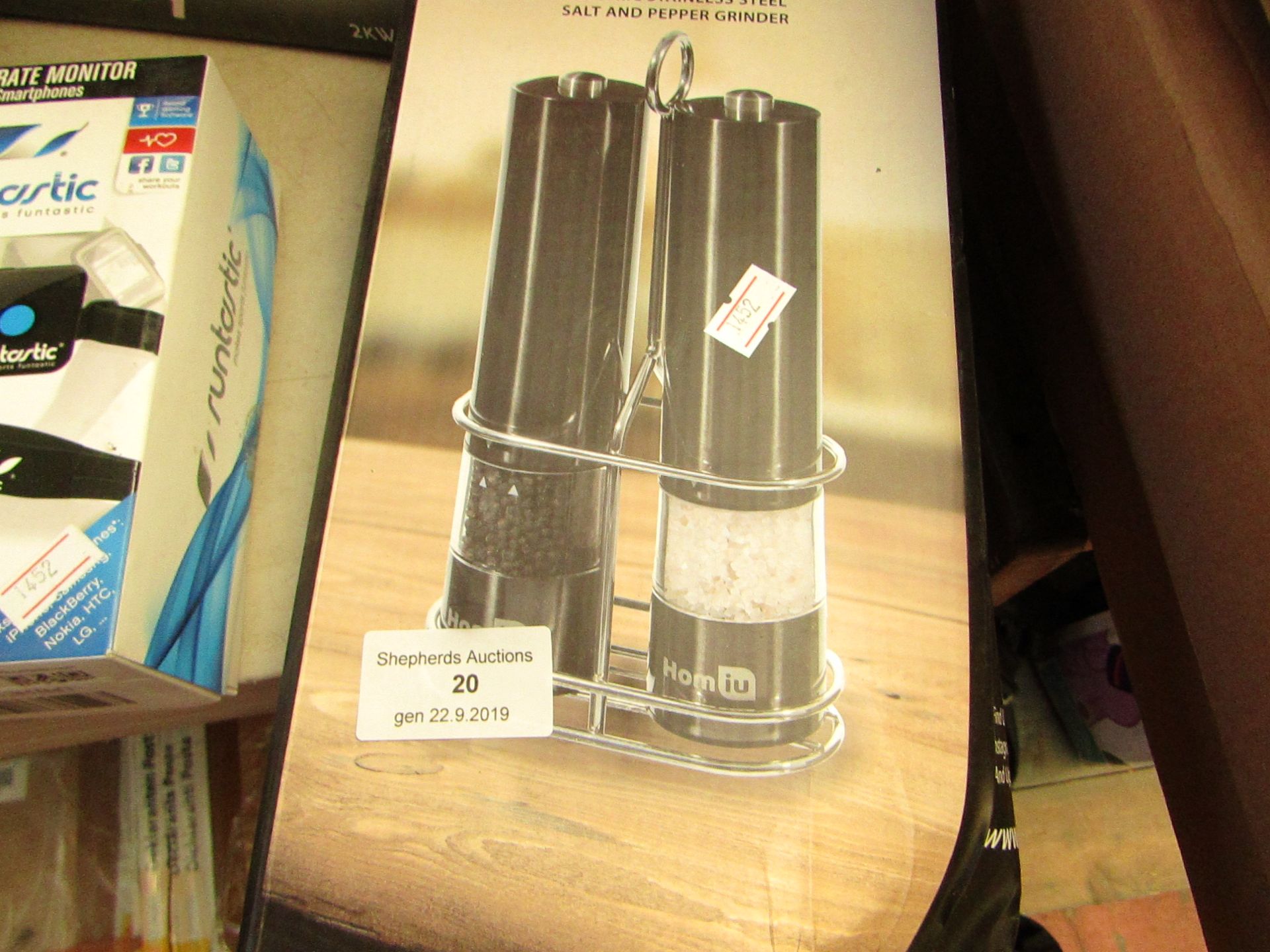 Electric stainless steel salt and pepper grinders, unchecked and boxed.