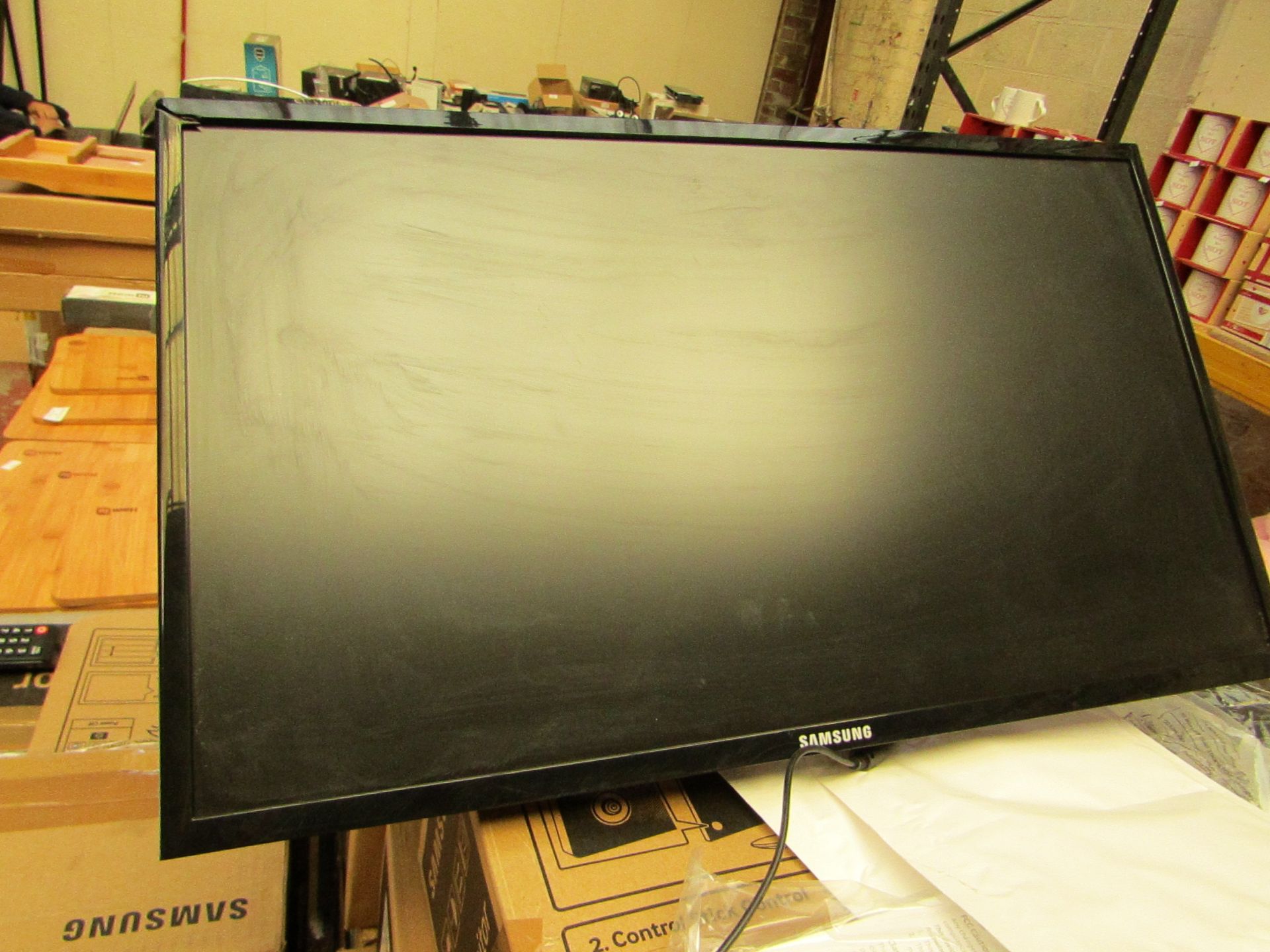 Samsung S24F350FHU 24" LED monitor, tested working and only has cosmetic damage to the frame which