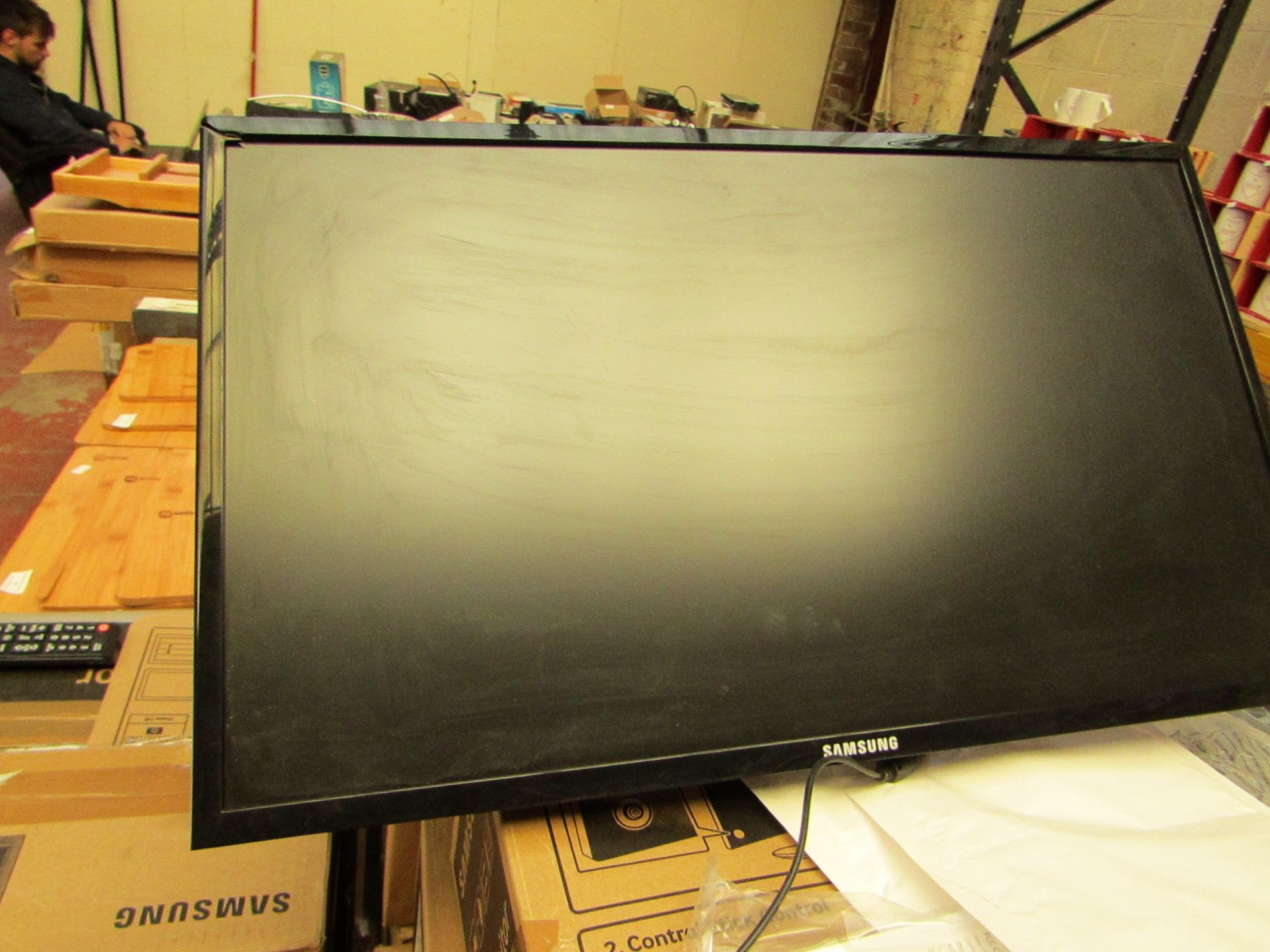 Samsung S24F350FHU 24" LED monitor, tested working and only has cosmetic damage to the frame which