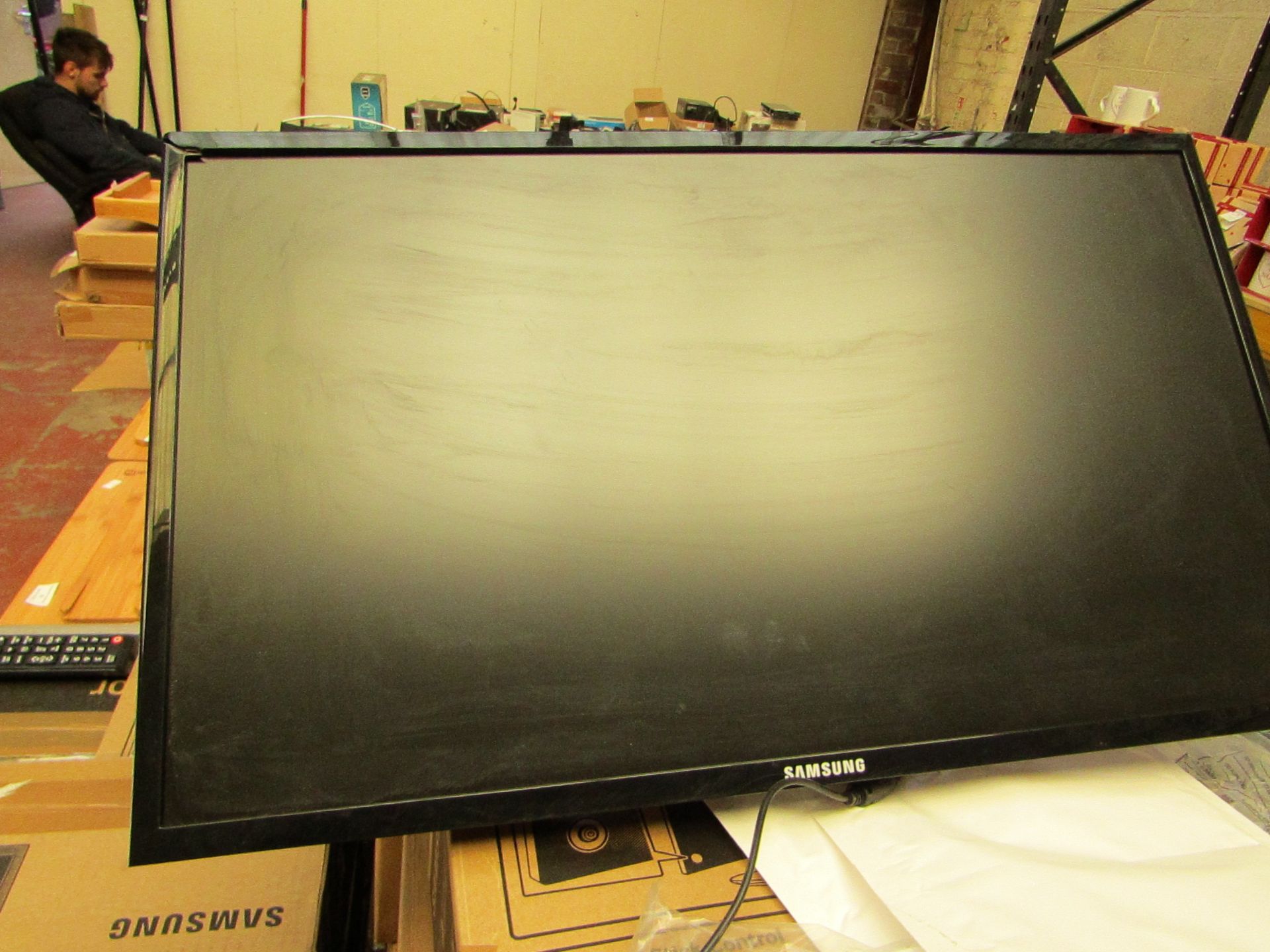 Samsung S24F350FHU 24" LED monitor, tested working and only has cosmetic damage to the frame which