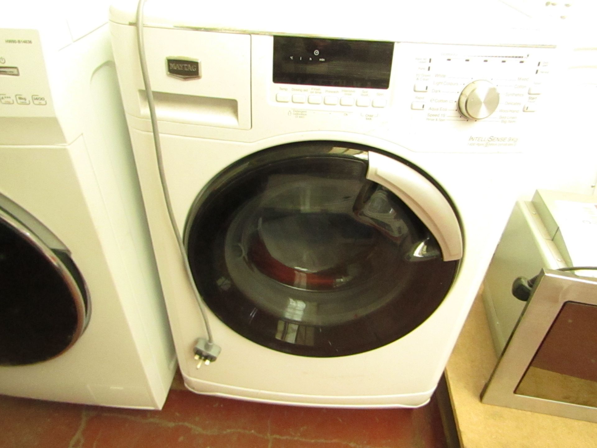 Maytag IntelliSense 9Kg washing machine, powers on and spins.