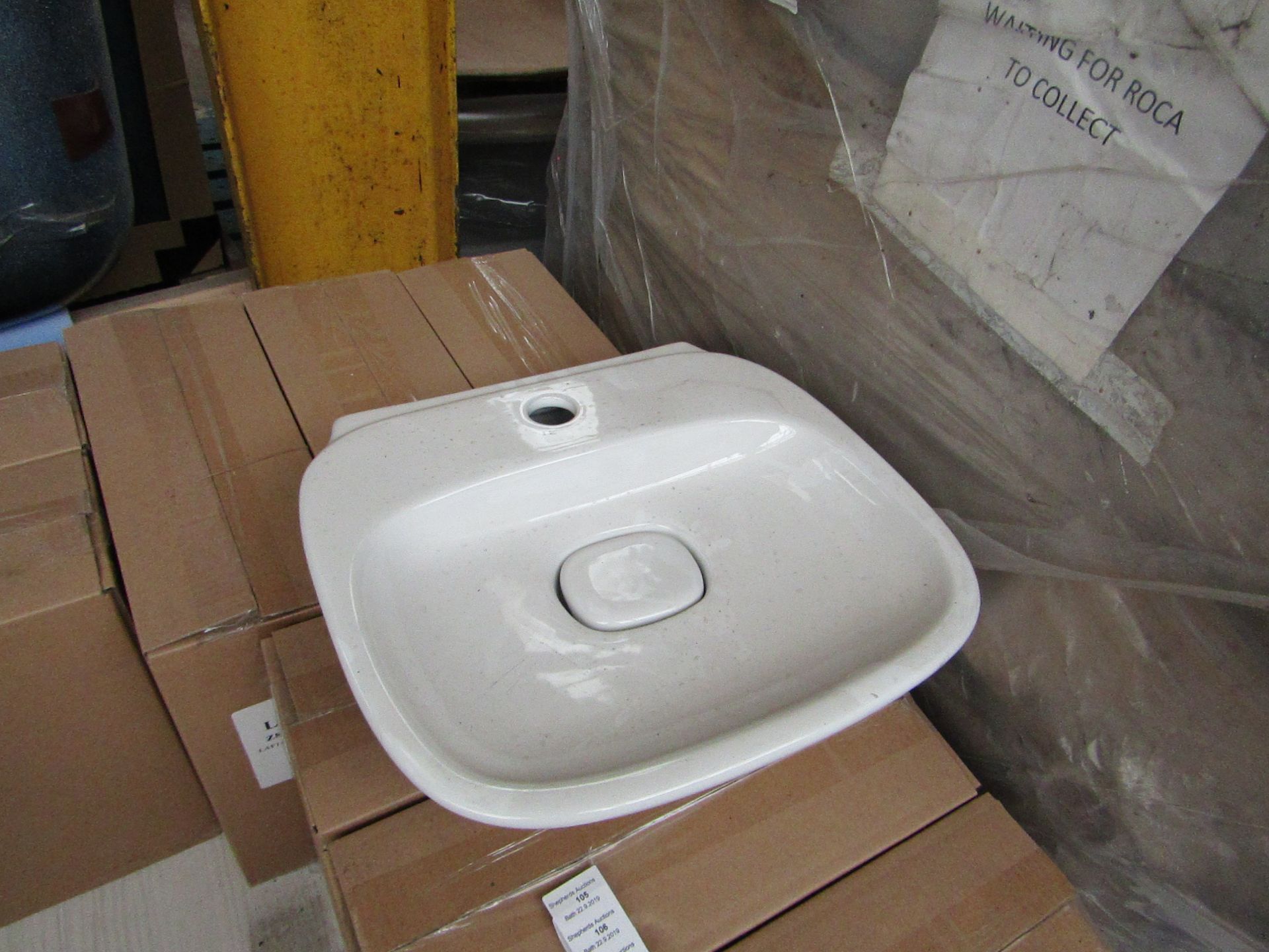 Laufen Made 500mm sink with ceramic plug cover and mono block mixer tap, new and boxed