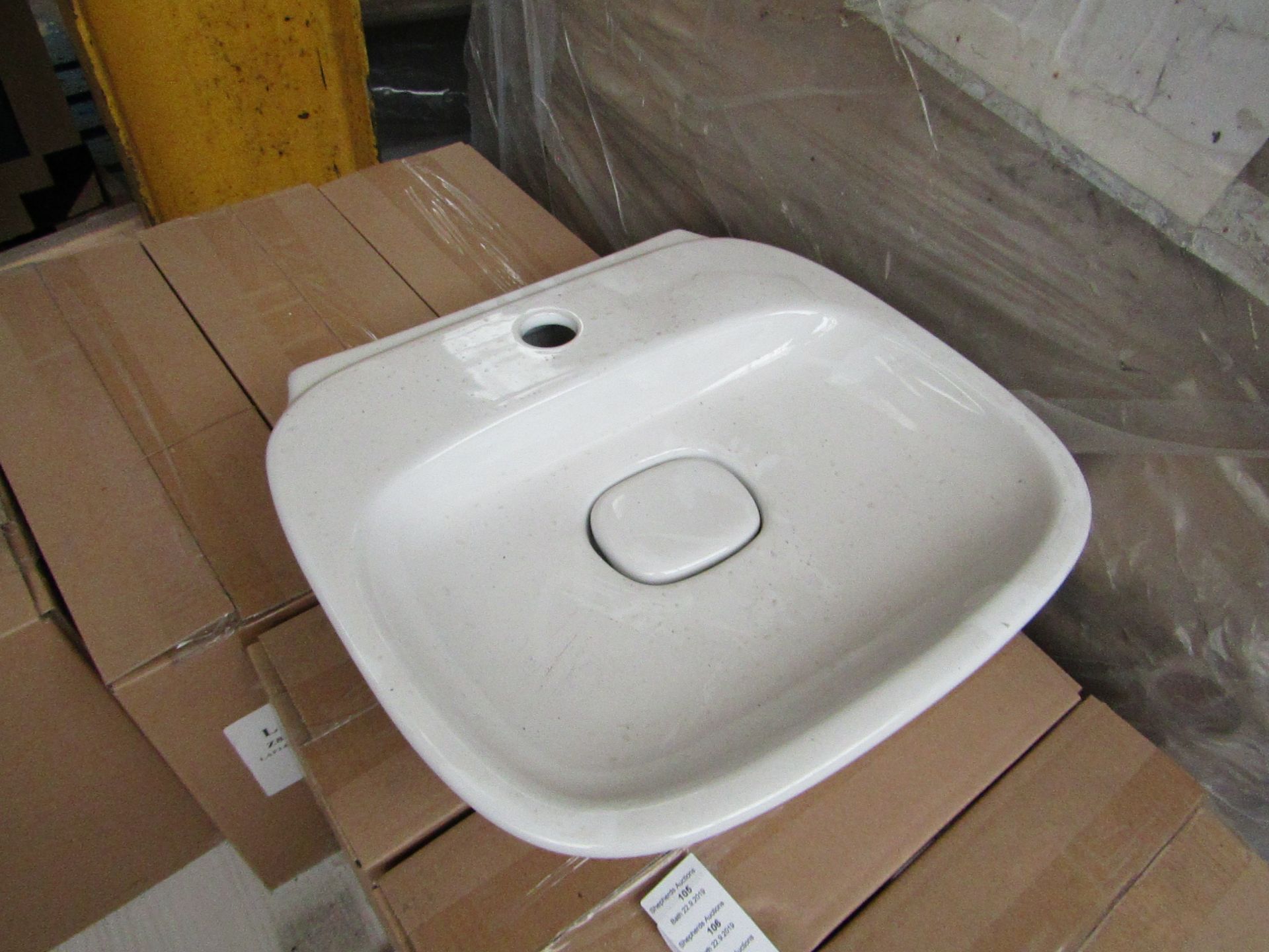 Pallet of approx 28x Laufen made 40cm sinks with ceramic waste cover, new