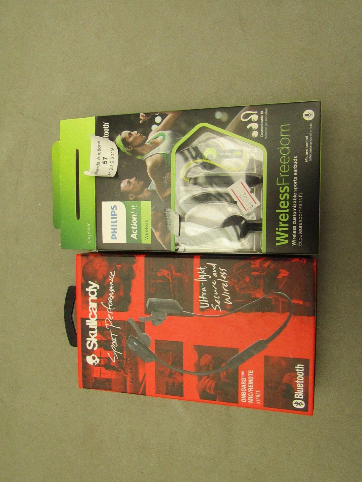 2 x sets of Wireless Headphones being 1 x Skull candy sport performance and 1 x Philips action