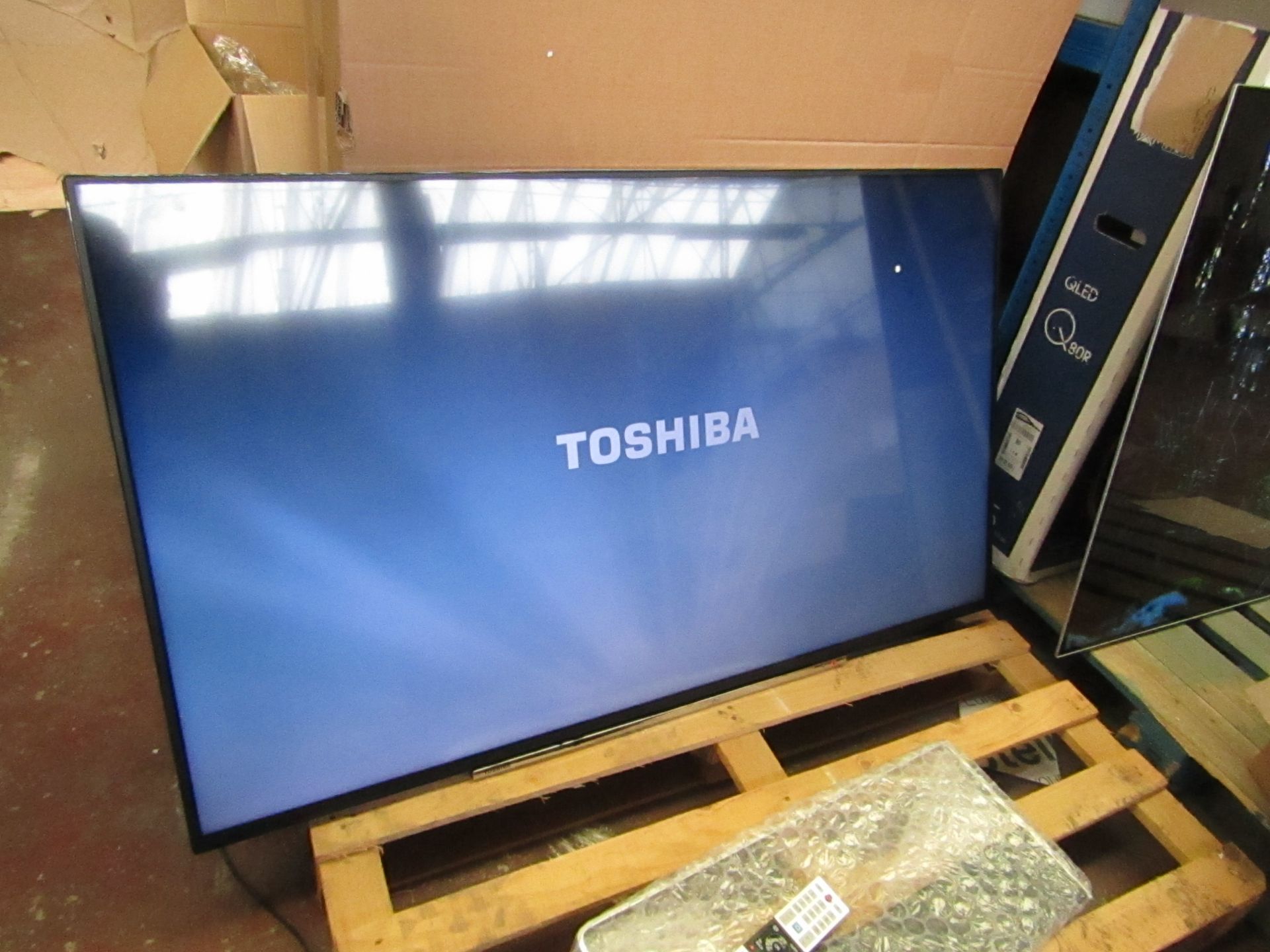 Toshiba 55U686308, 55" LED TV with remote, only part of the stand is present, tested working, please