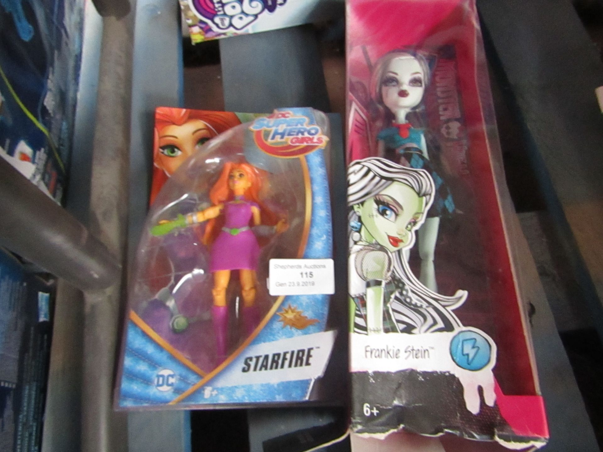 2x Items being; DC Superheros Starfire doll with a Monster High doll, both packaged.