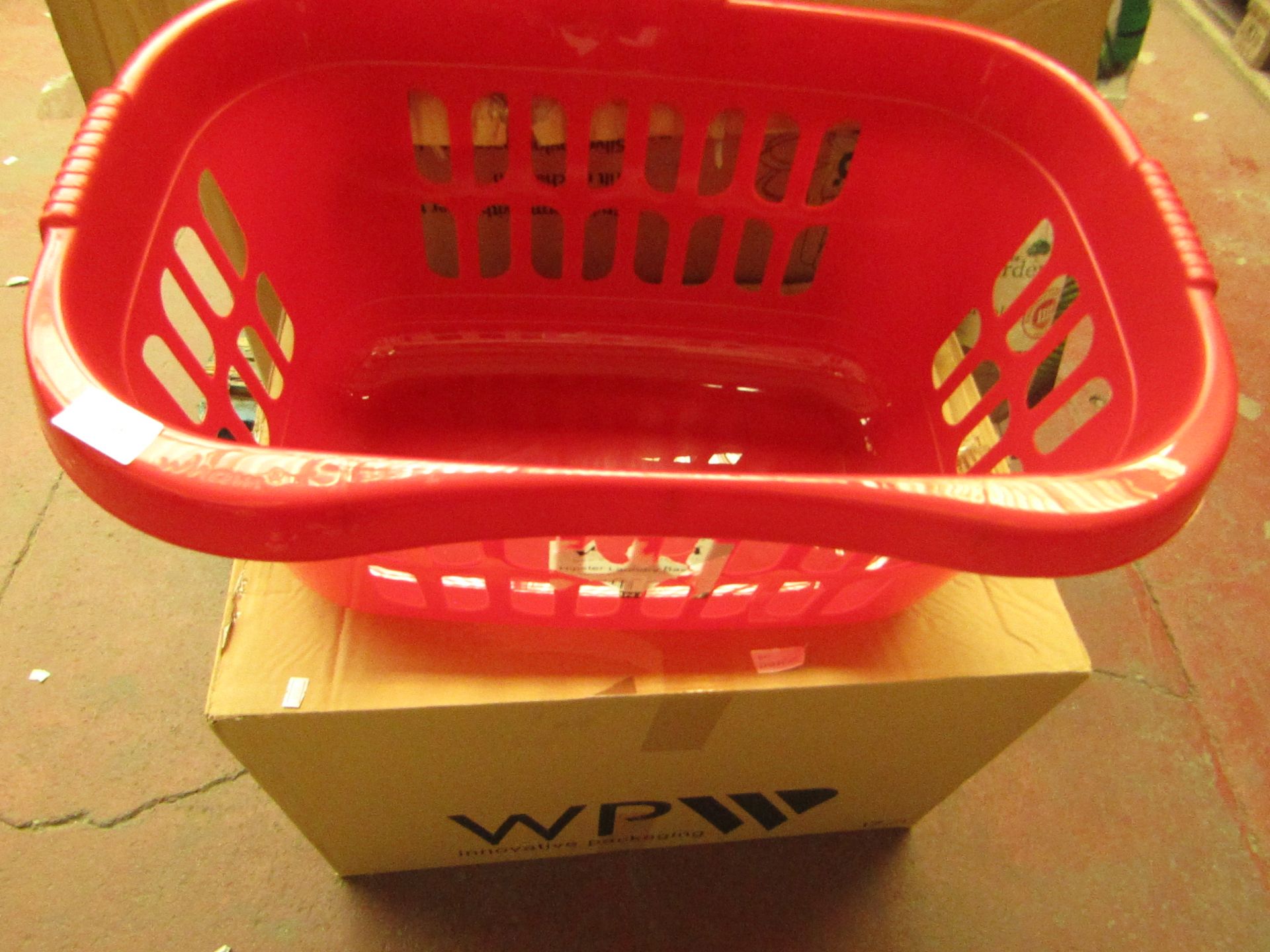 red coloured laundry basket, new and boxed.