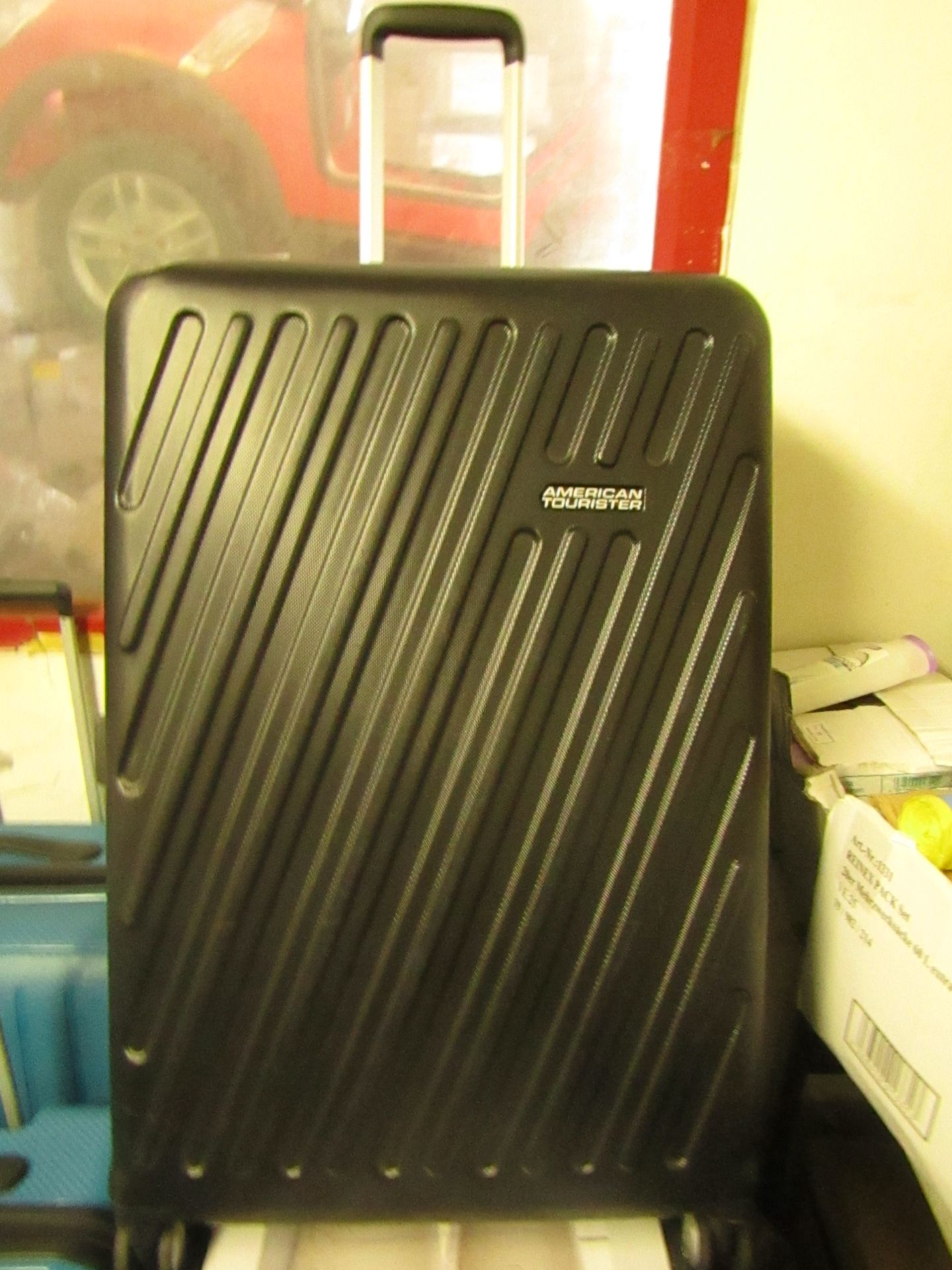 American Tourister large suitcase, has dents.