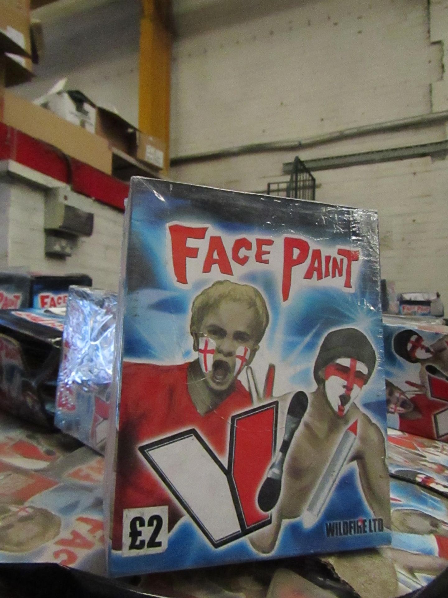 Approx 400x packs of 12 red and white face paint, all new and boxed.