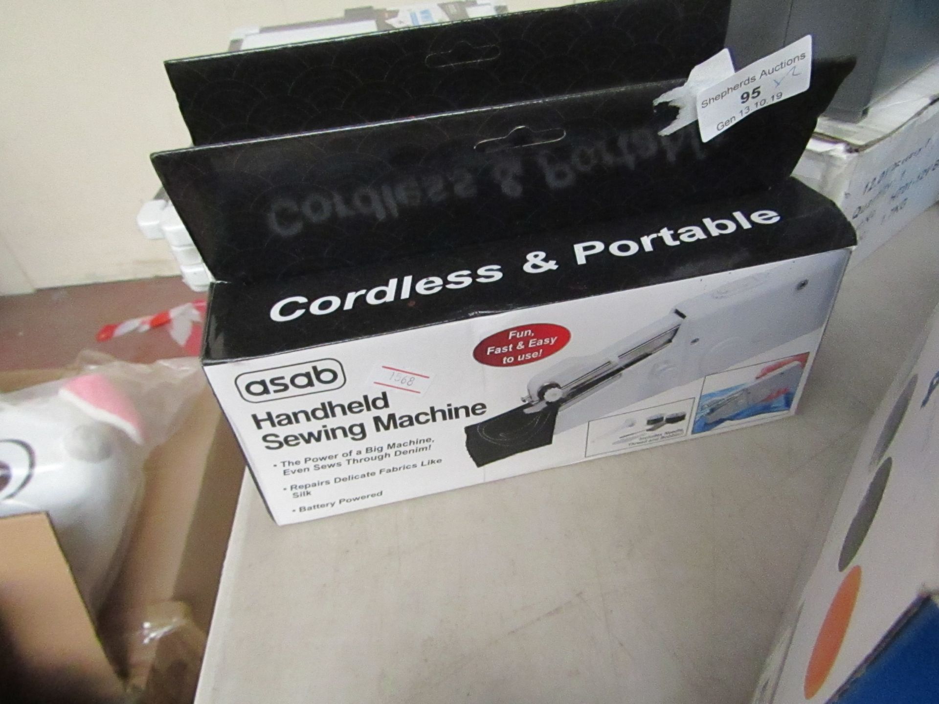 2x Cordless and portable handheld sewing machine, untested and boxed.