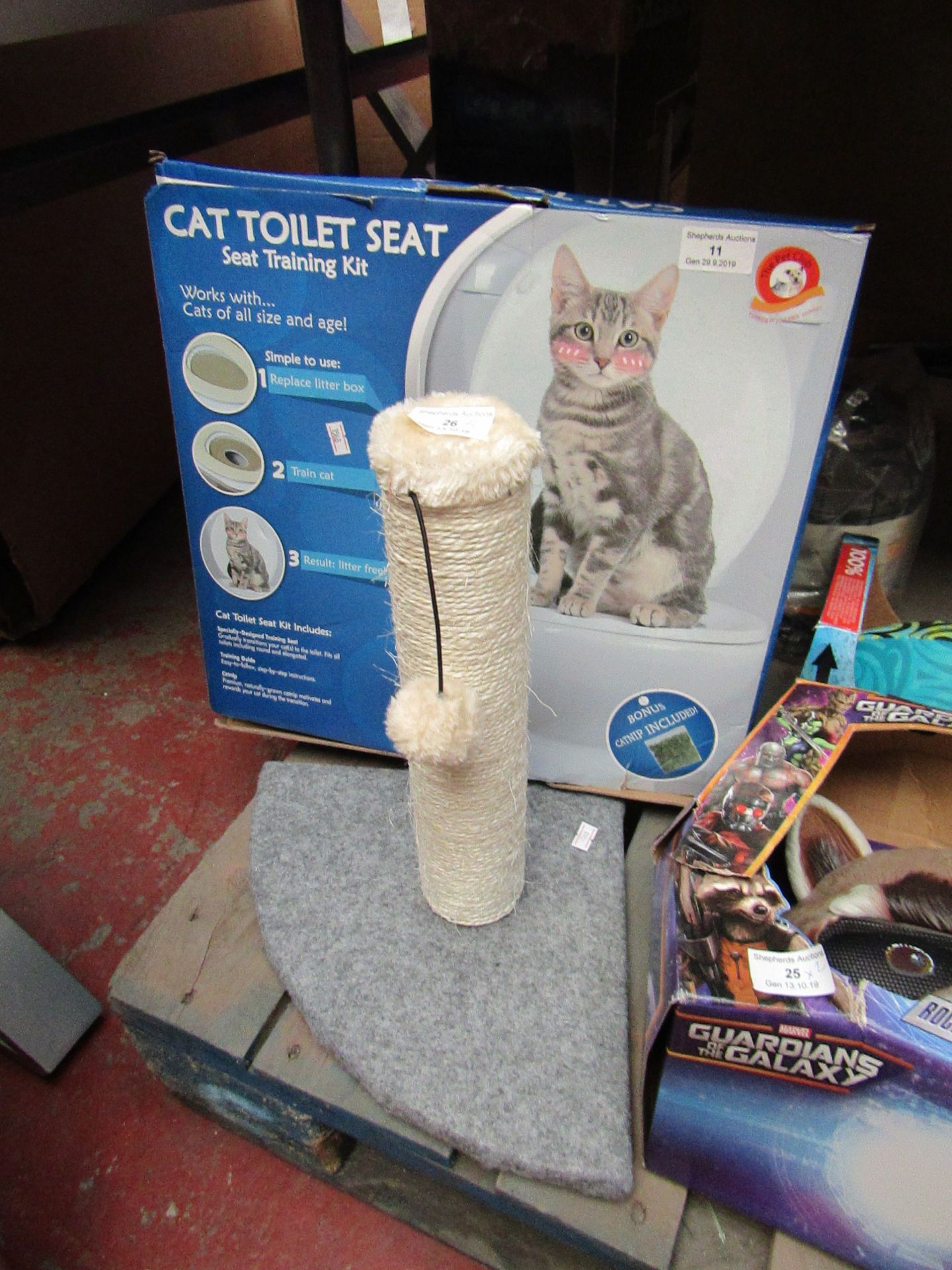 2x Cat accessories being; scratching post with a cat toilet, one boxed.