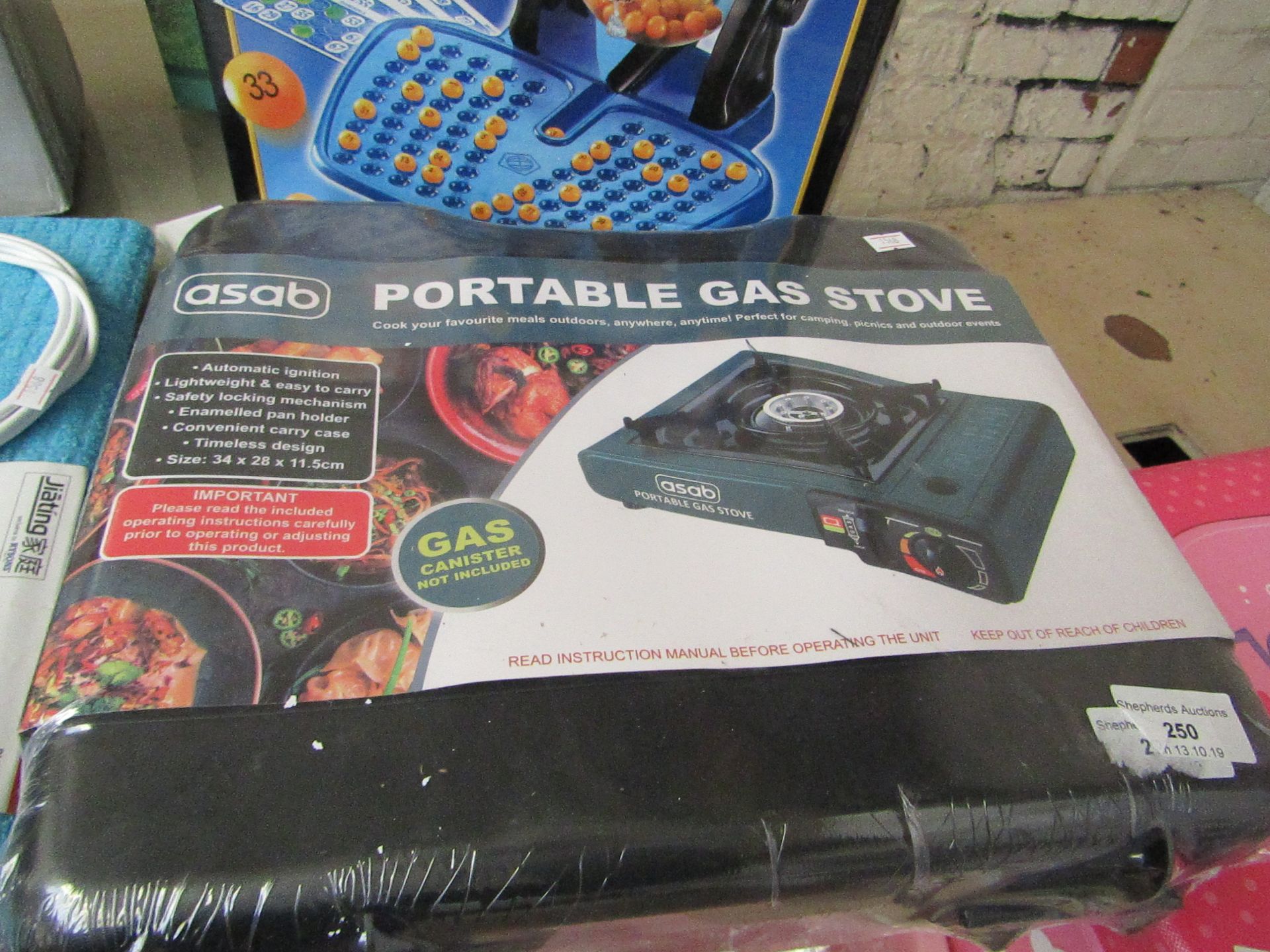 Portable gas stove, new and in carry case.