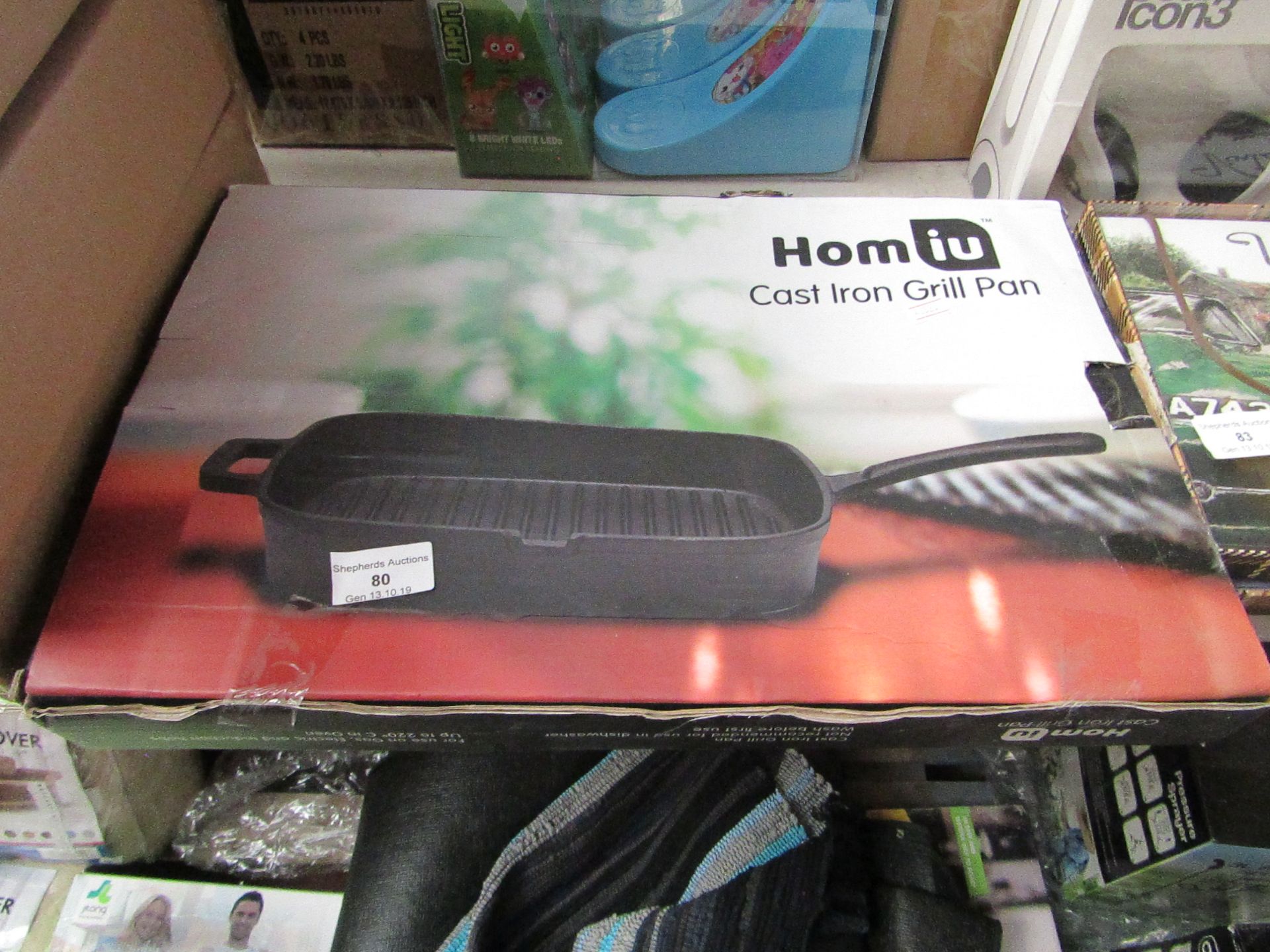 Cast iron grill pan, unchecked and boxed.