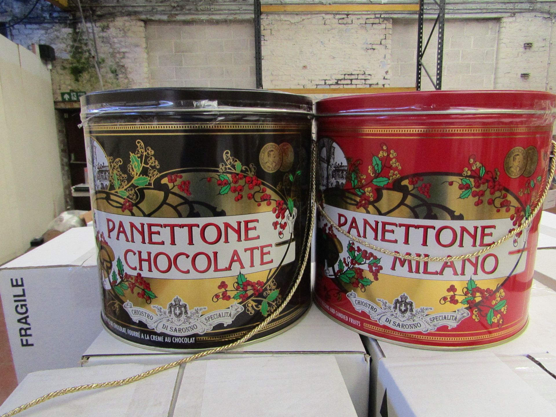 2 x Panettone's in tins.1 being chocolate and 1 being milano.BB 22/07/19