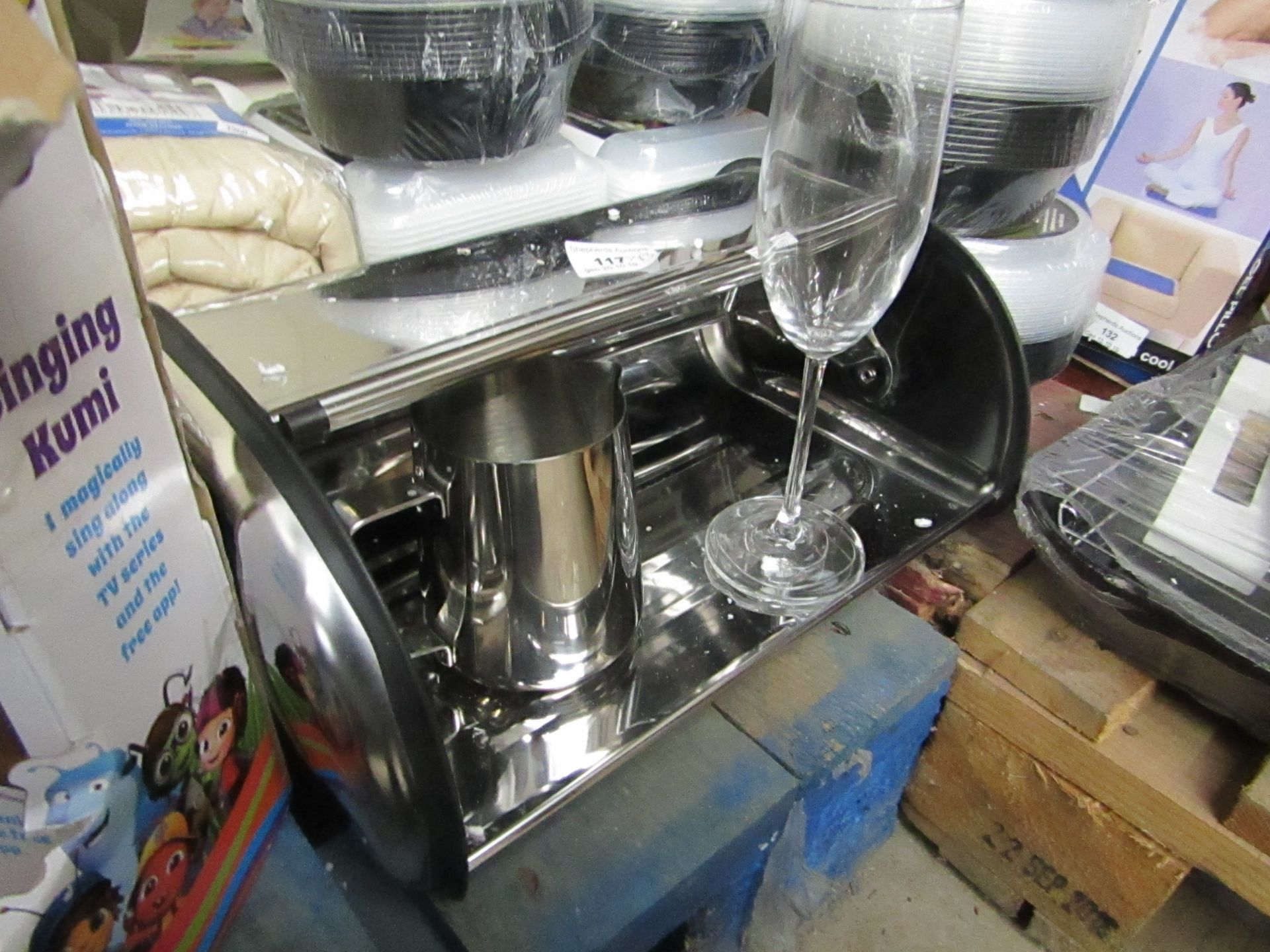 3 Items being a Stainless steel bread bin,a milf jug & a champagne flute.All unused