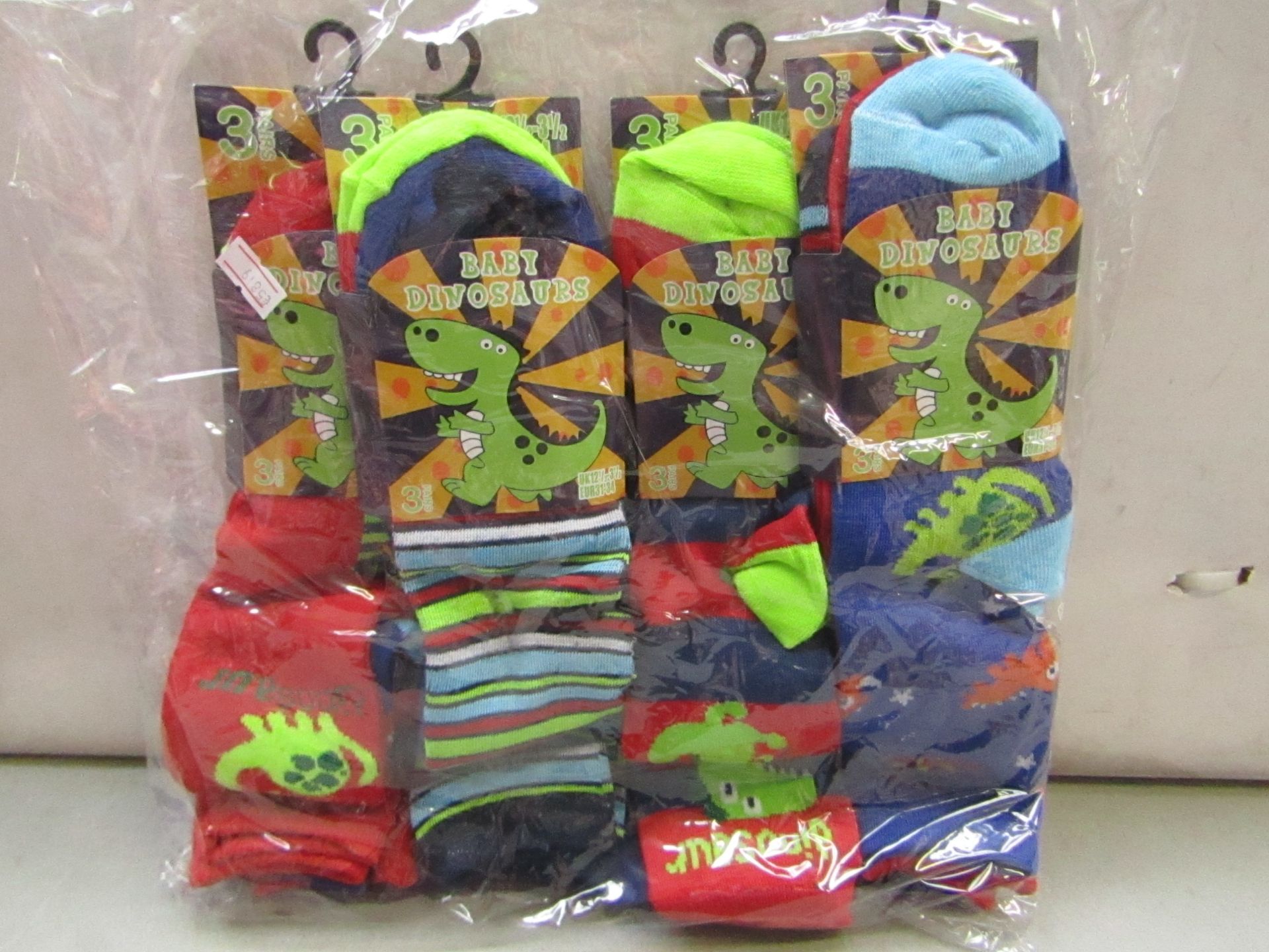 Pack of 12 Childrens Baby Dinosaur Themed socks size 12 1/2 to 3 1/2 all new in packaging