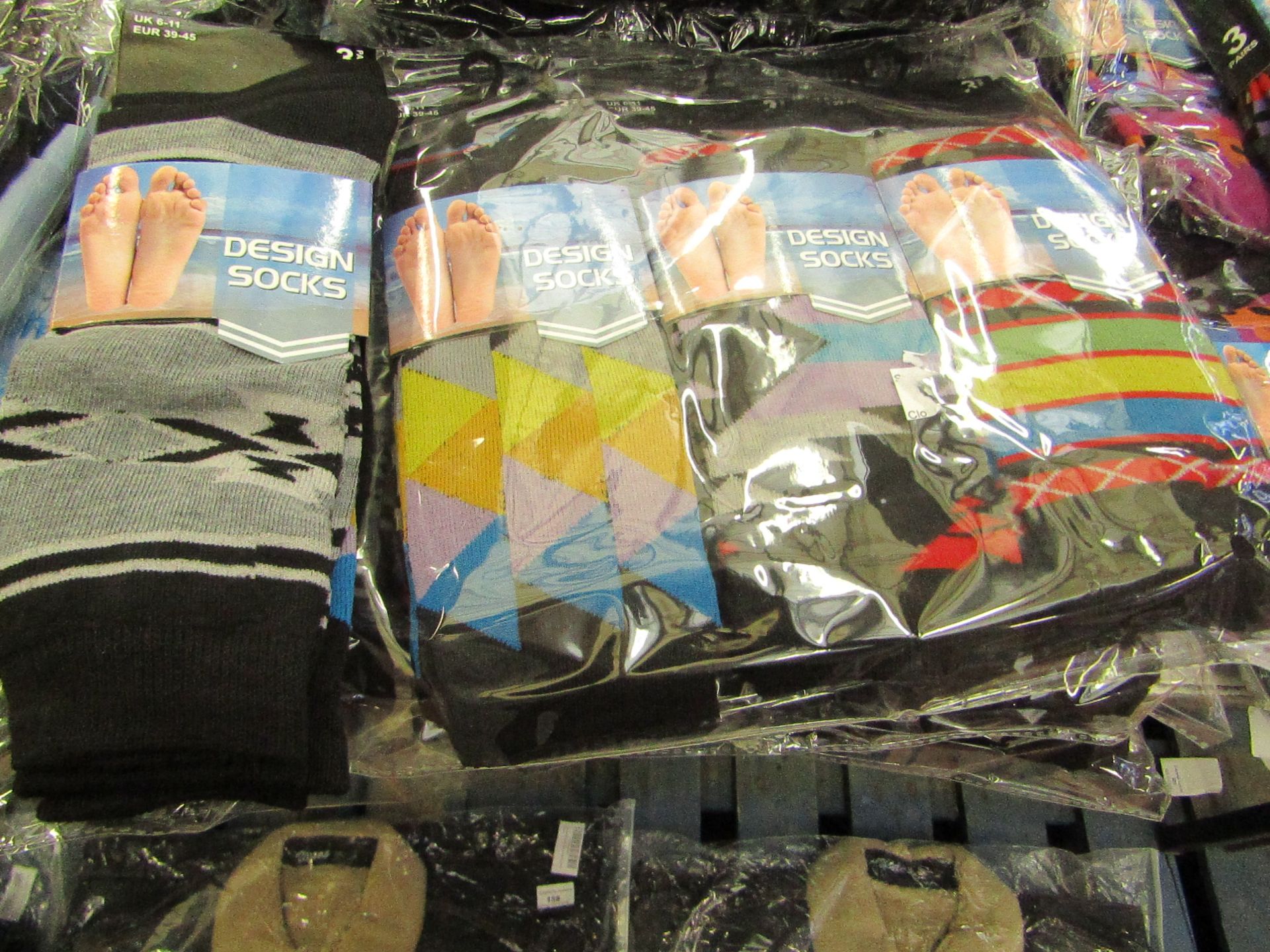 Pack of 12 pairs Mens Design Patterned Socks, size 6-11 all new in packaging see image for design