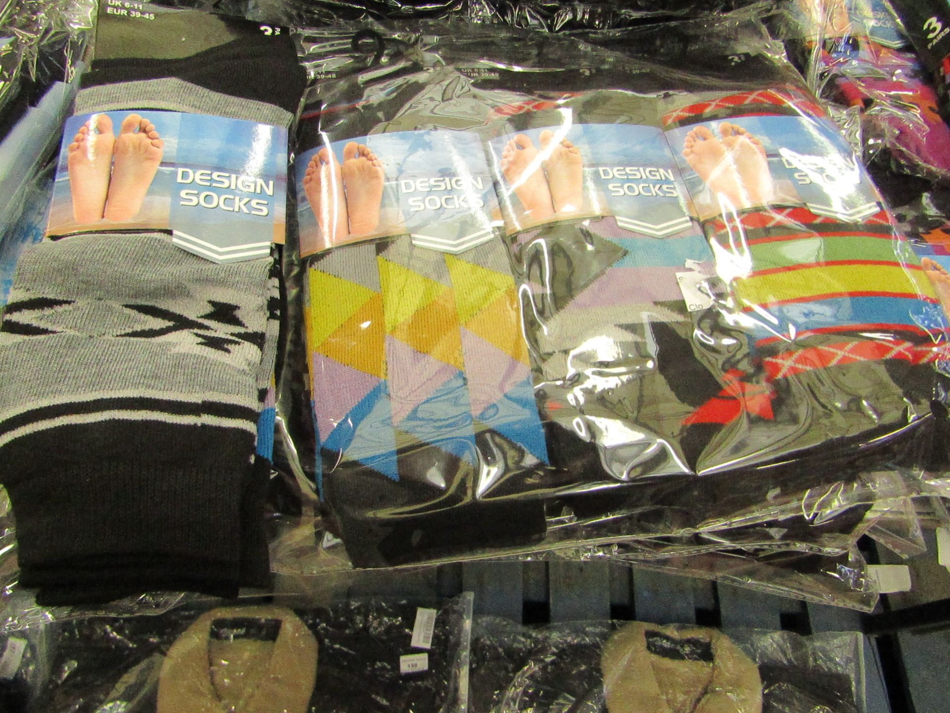 Pack of 12 pairs Mens Design Patterned Socks, size 6-11 all new in packaging see image for design