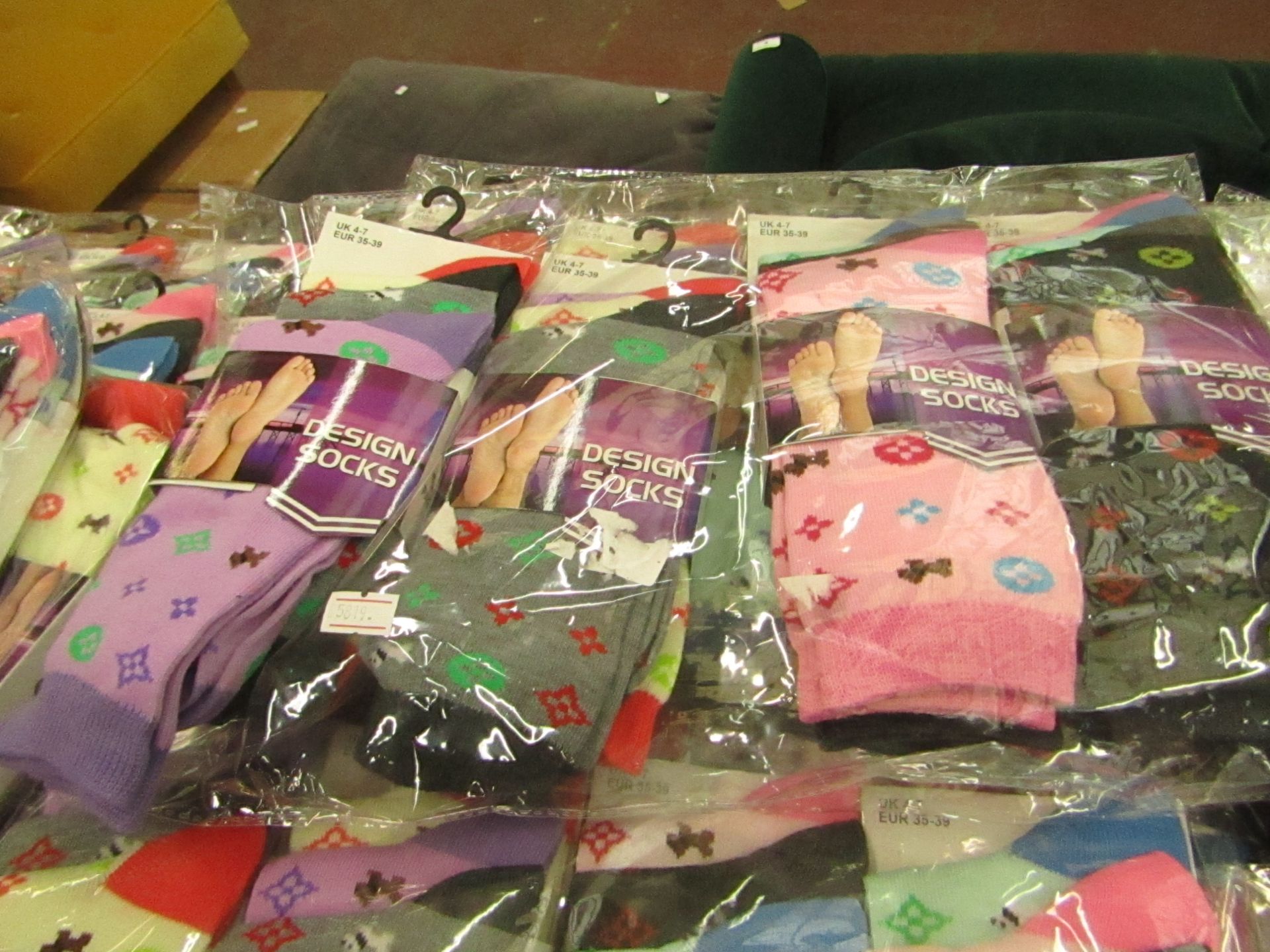 Pack of 12 x pairs Ladies Design Socks size 4-7 all new in packaging see image for design