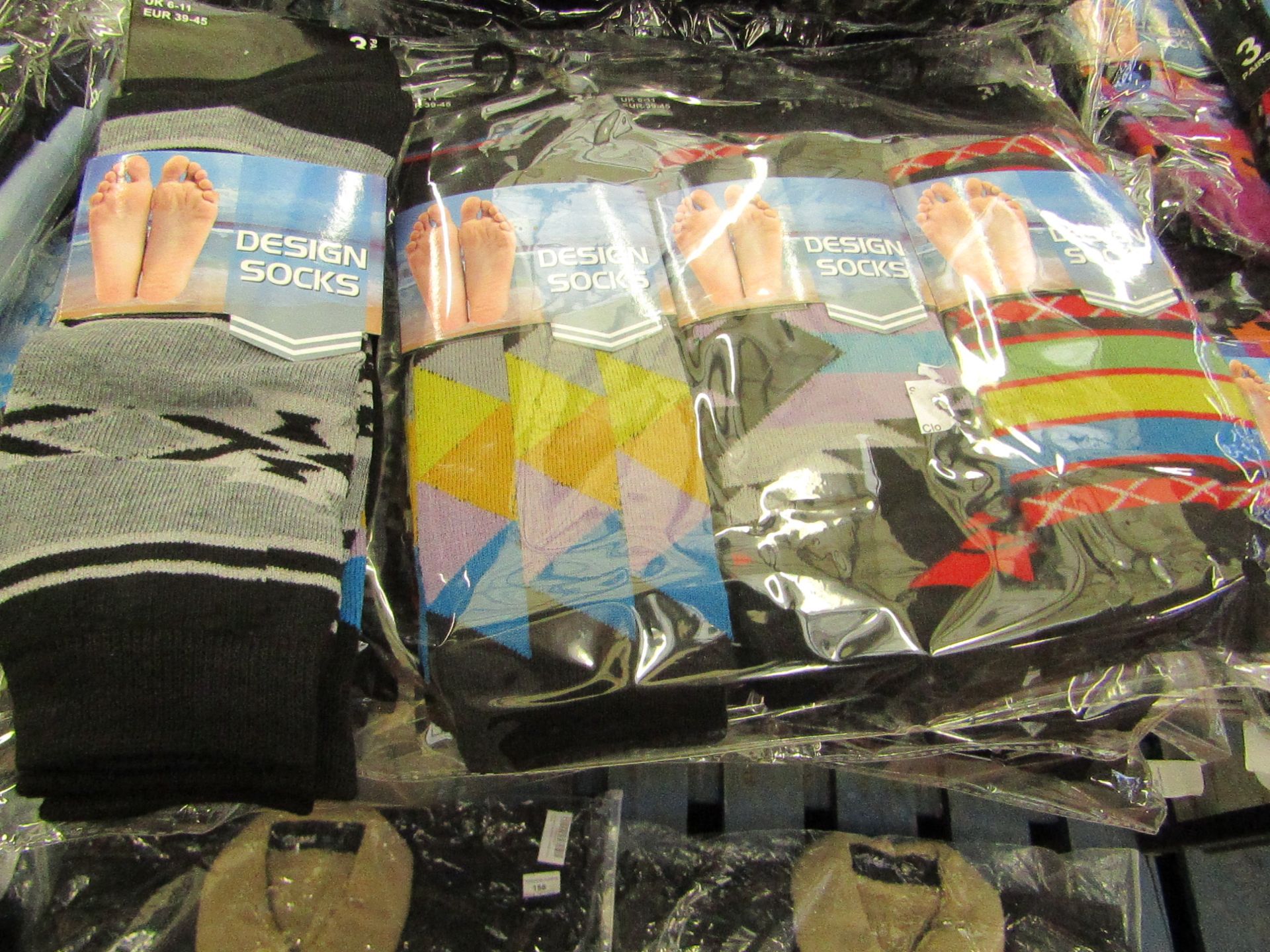 Pack of 12 pairs Mens Design Patterned Socks, size 6-11 all new in packaging see image for design