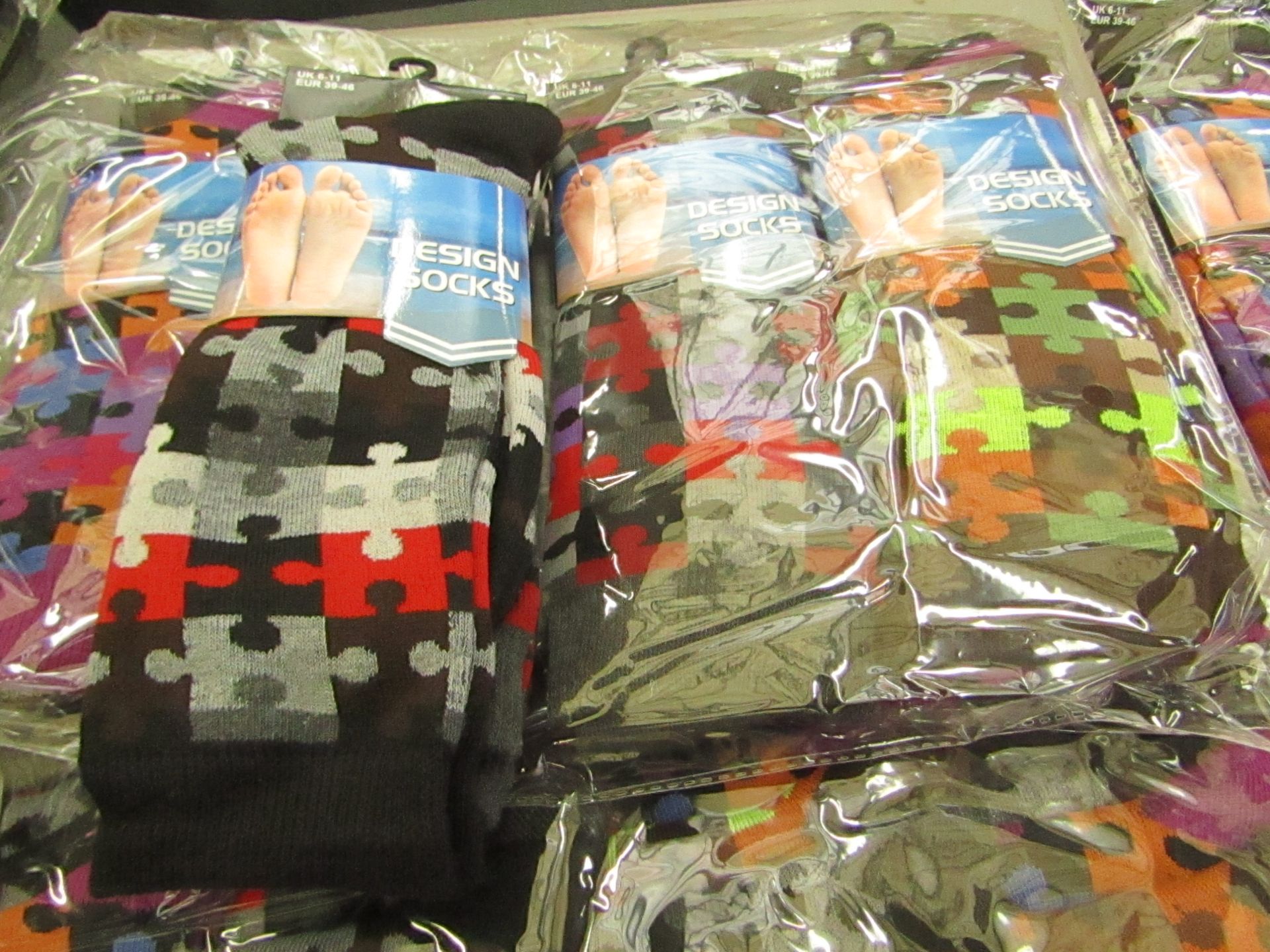 Pack of 12 pairs Mens Design Patterned Socks, size 6-11 all new in packaging see image for design