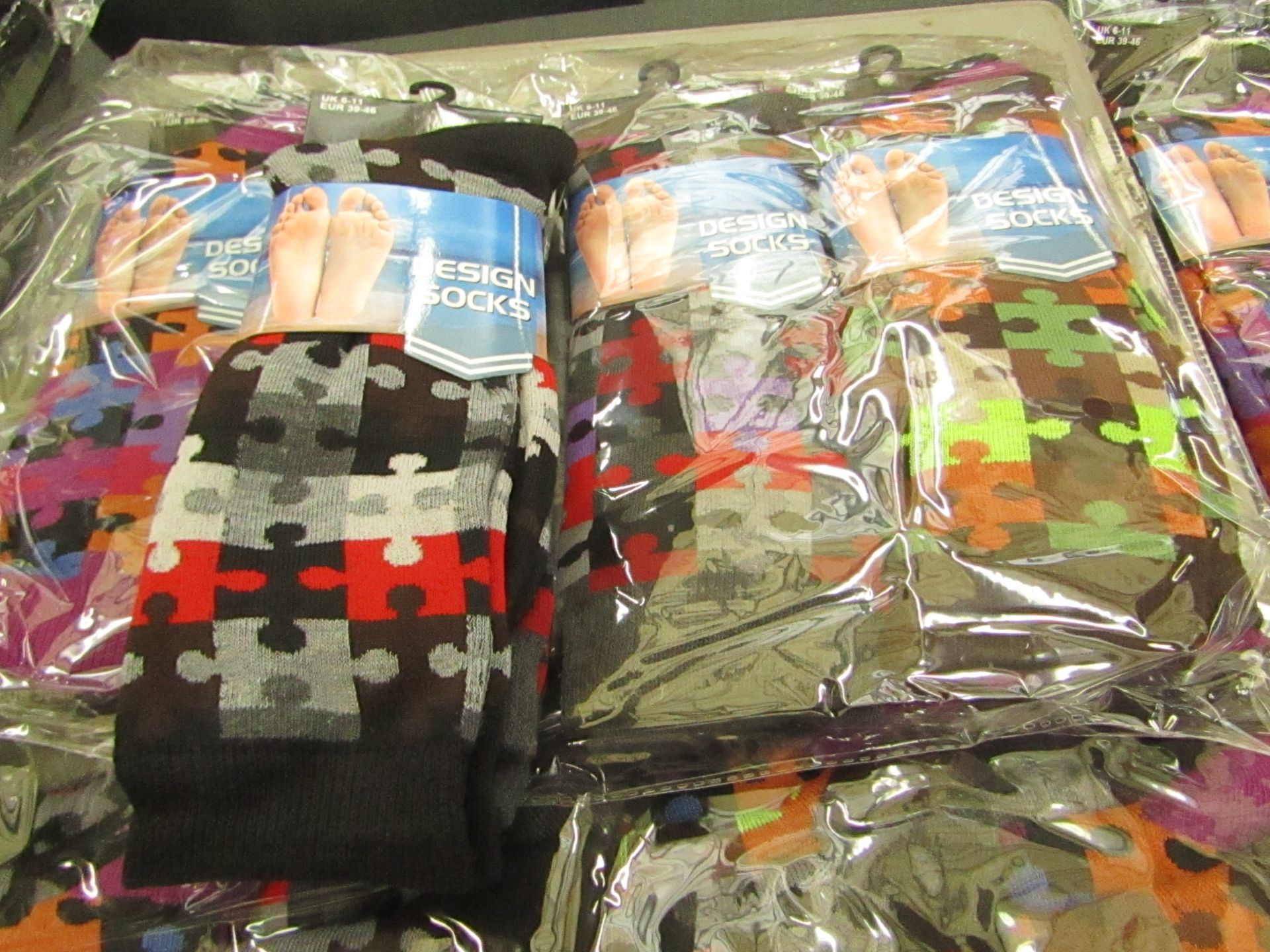 Pack of 12 pairs Mens Design Patterned Socks, size 6-11 all new in packaging see image for design