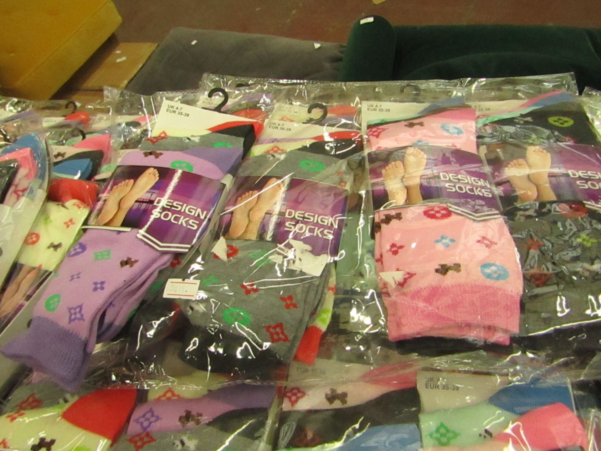 Pack of 12 x pairs Ladies Design Socks size 4-7 all new in packaging see image for design