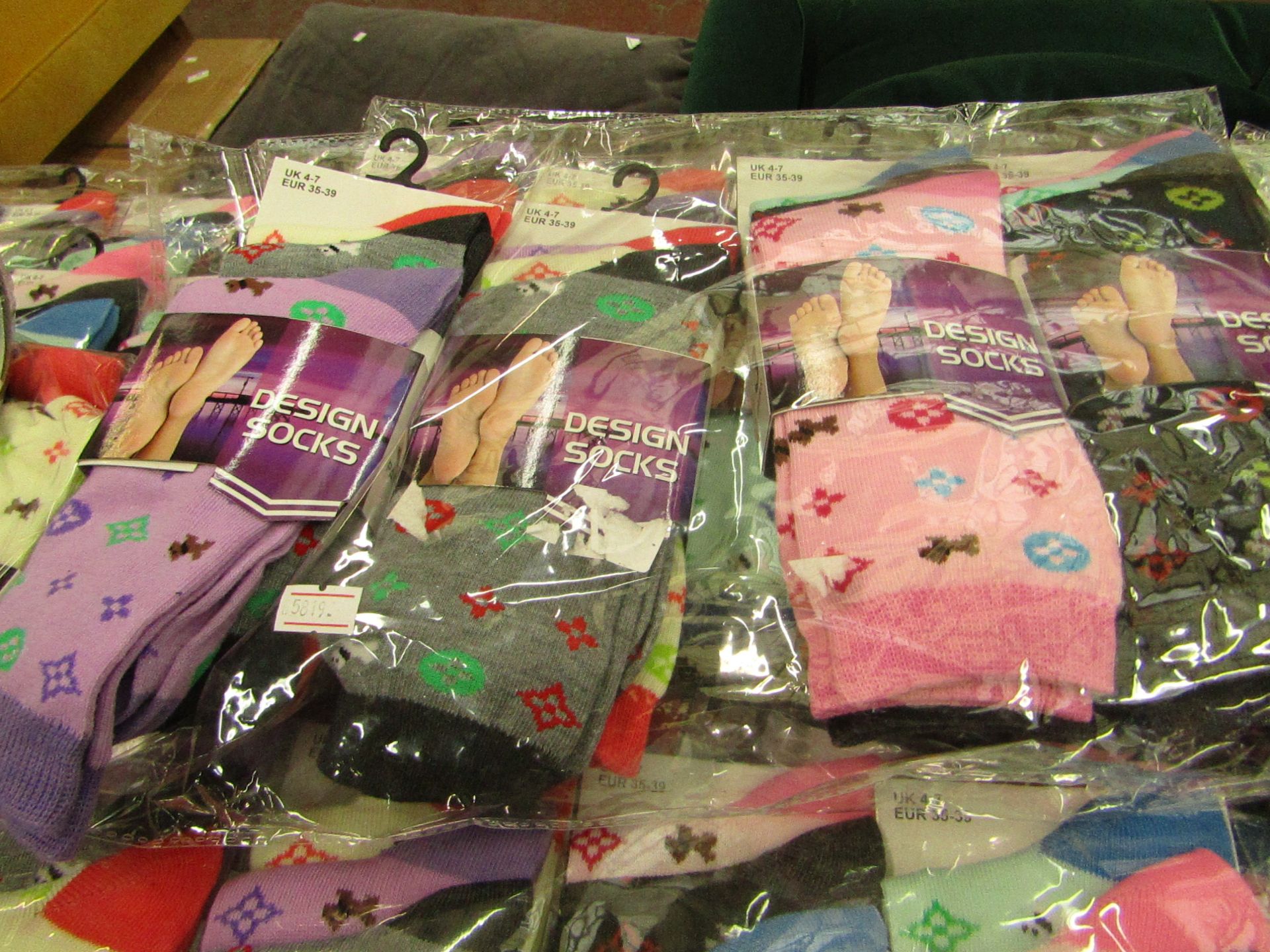 Pack of 12 x pairs Ladies Design Socks size 4-7 all new in packaging see image for design