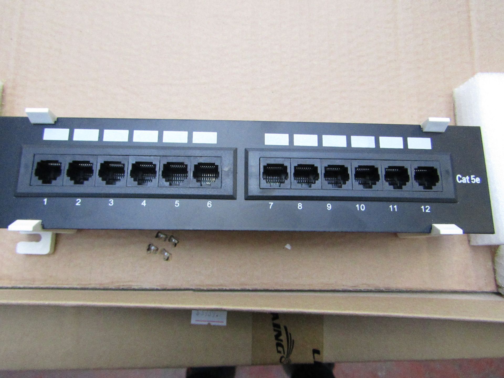 12 Port Cat5e 10" UTP Patch Panel, unused and boxed.