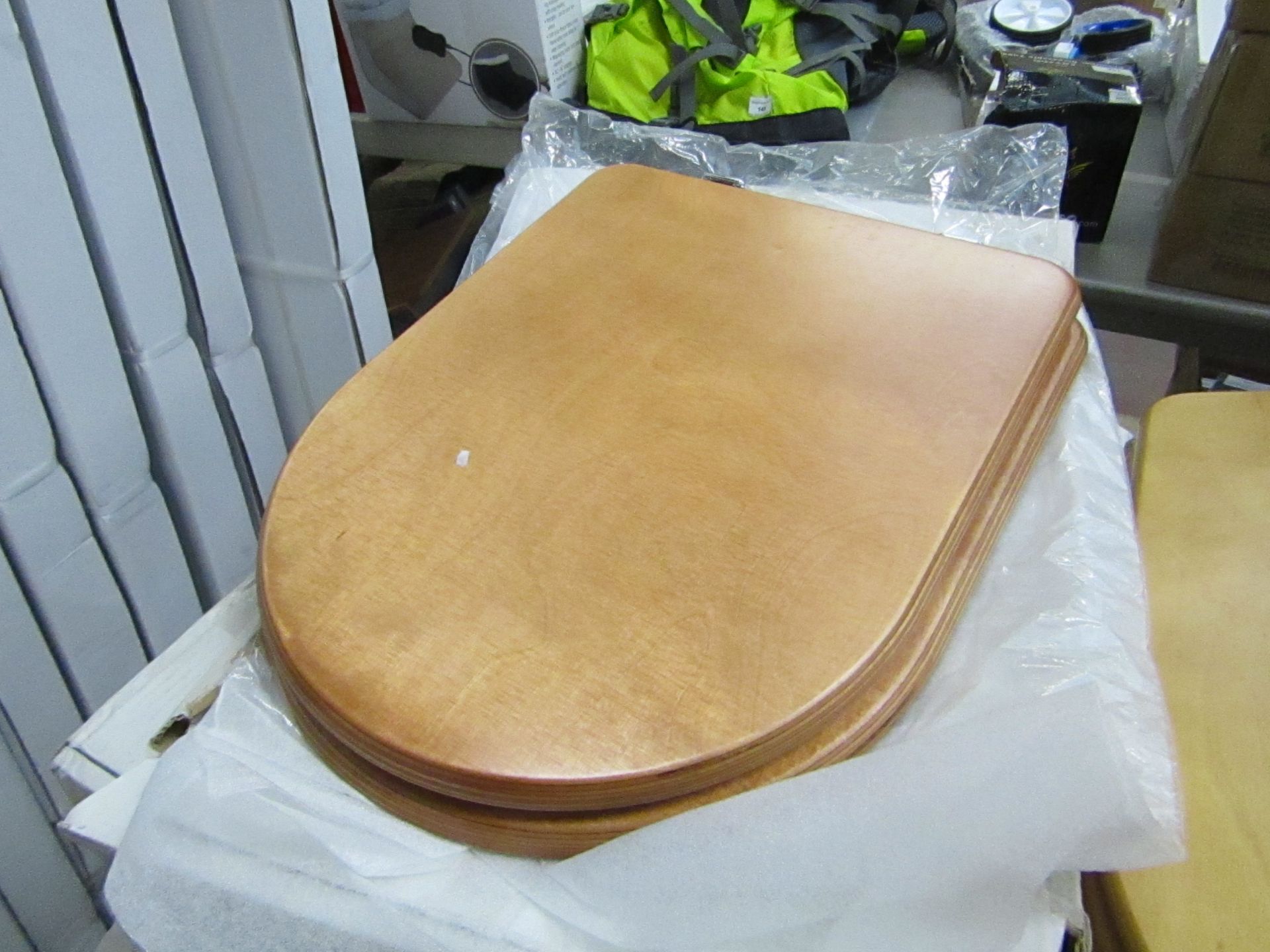 Noble wooden toilet seat, new and boxed.