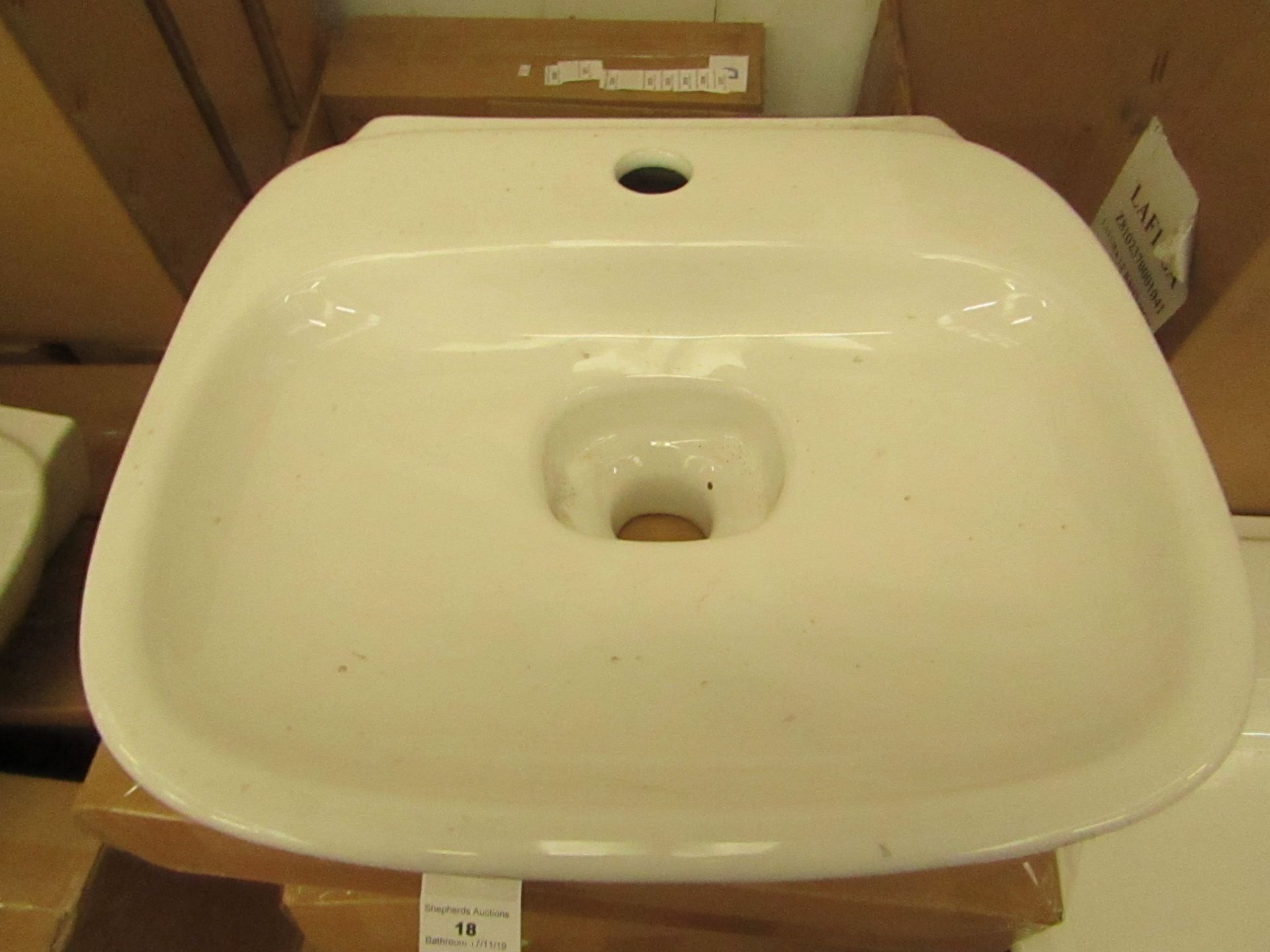 Laufen made 400mm 1 tap Hole sink with porcelain drain cover, new and boxed.