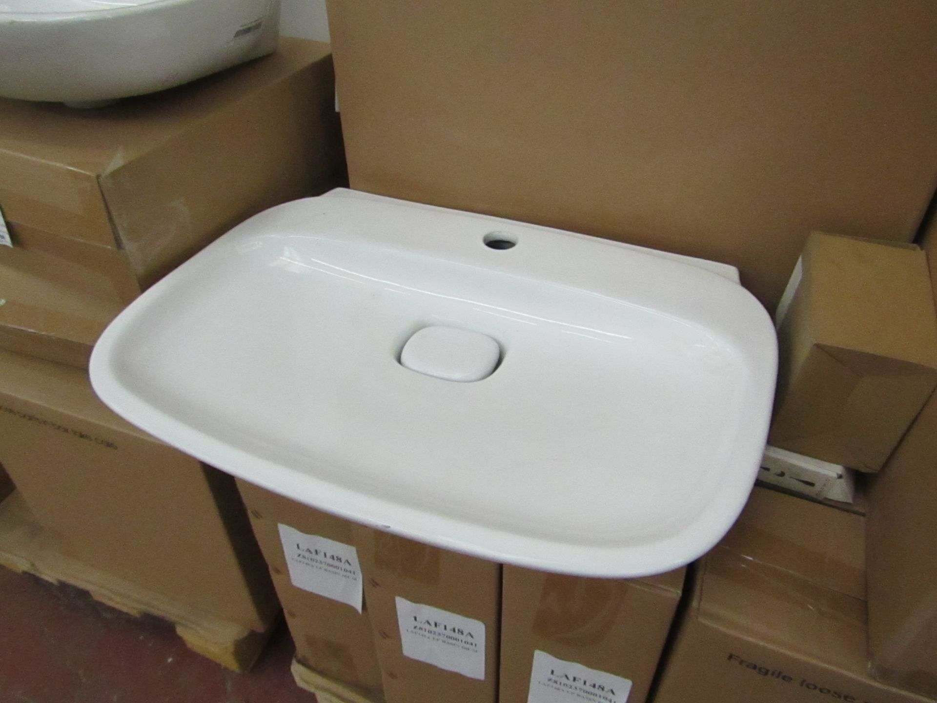 Laufen made 600mm 1 tap Hole sink with porcelain drain cover and matching full pedestal, both new