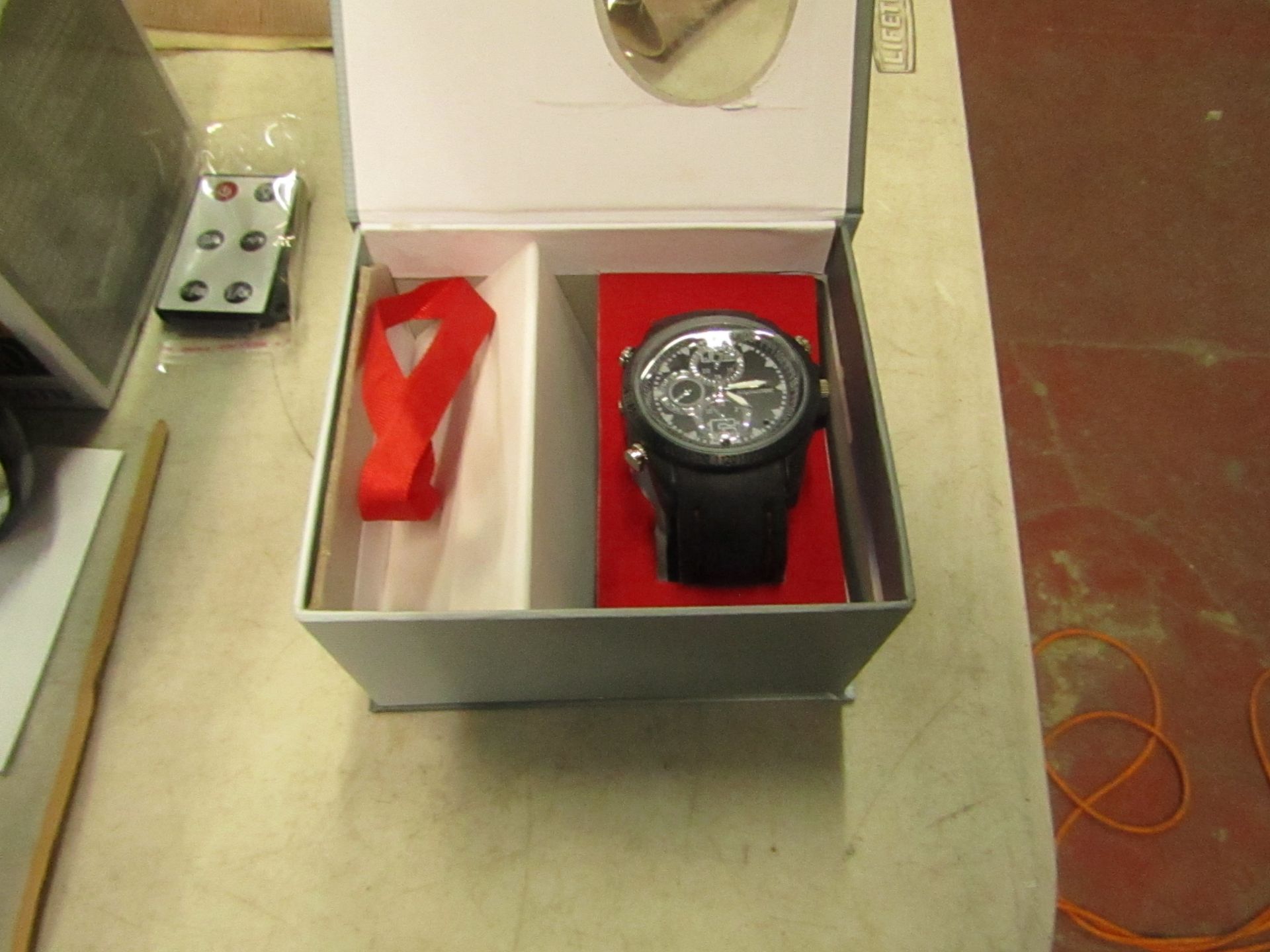 WATCH - Includes mp3 player, multiple audio and built in battery, untested and boxed.