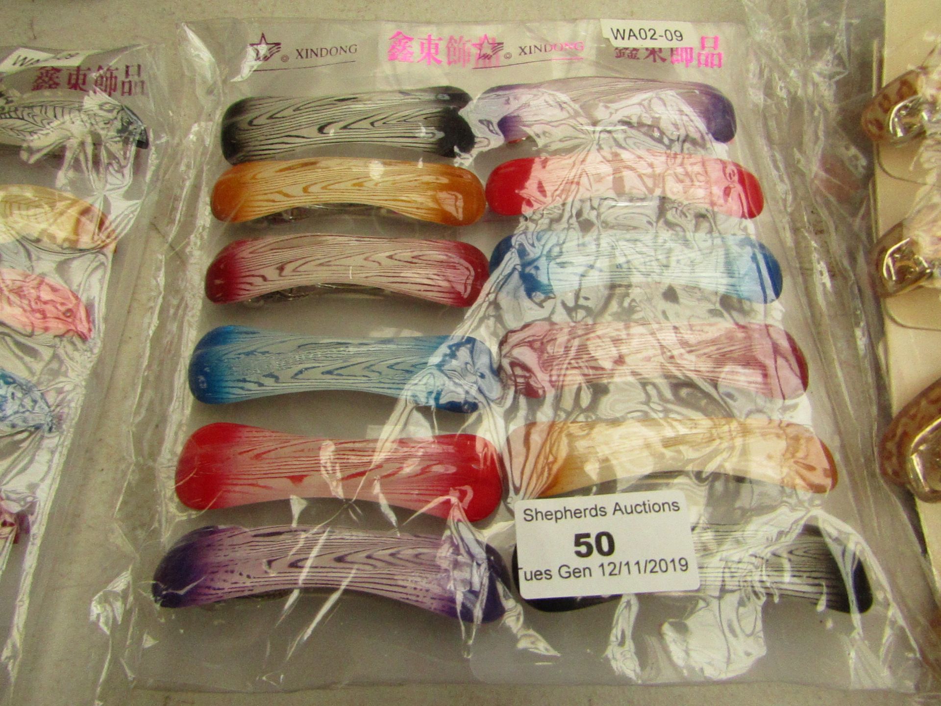 12x Hairs clips, see picture for design, new and packaged.