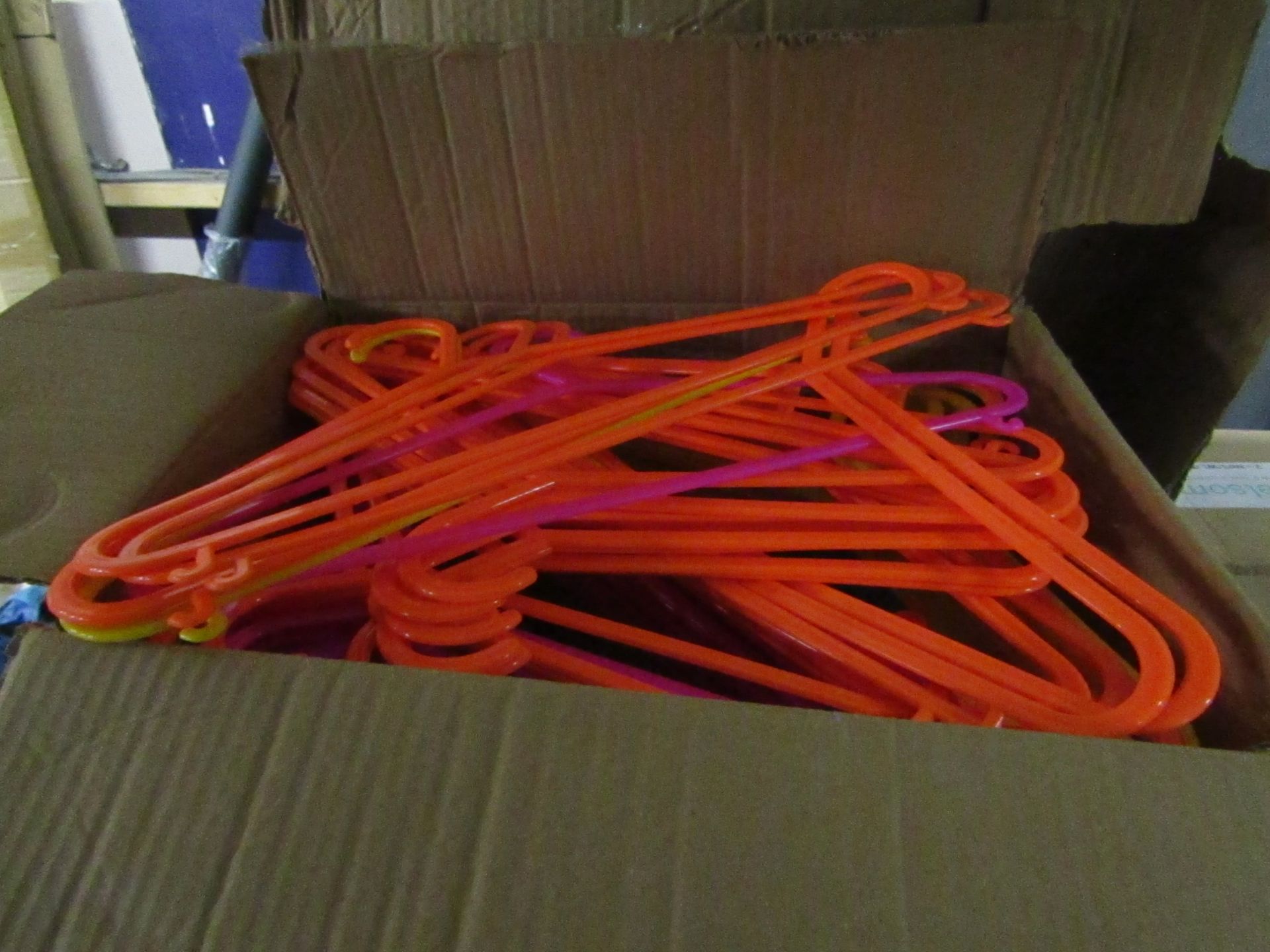 600x Rainbow plastic hangers, new and boxed.