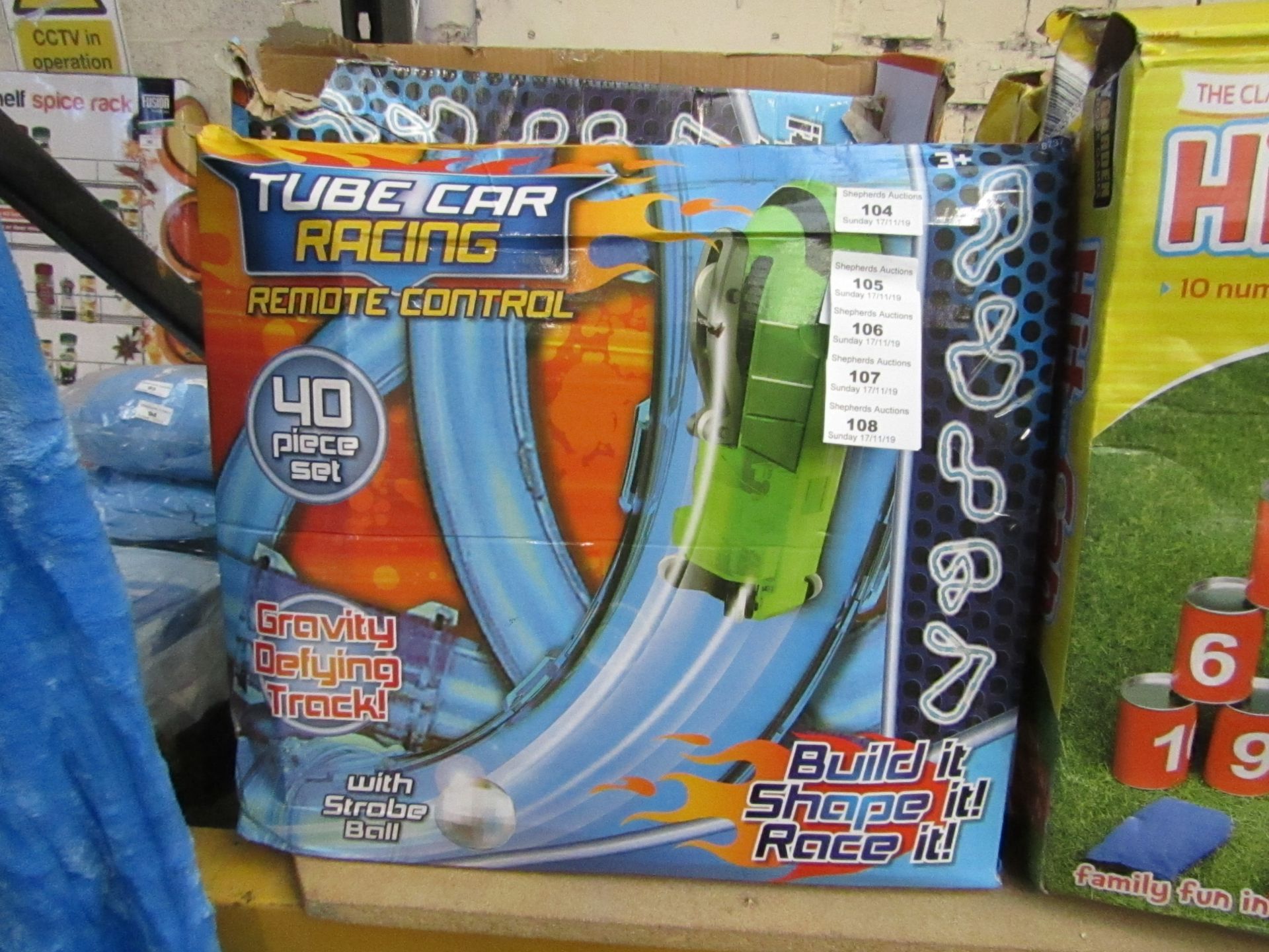 Tube car Racing remote control track with strobe ball.Boxed but unchecked