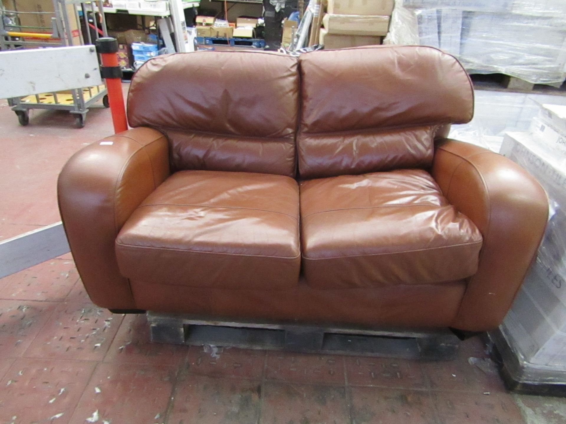Brown leather 2 Seater sofa, no major damaged, see picture for design.