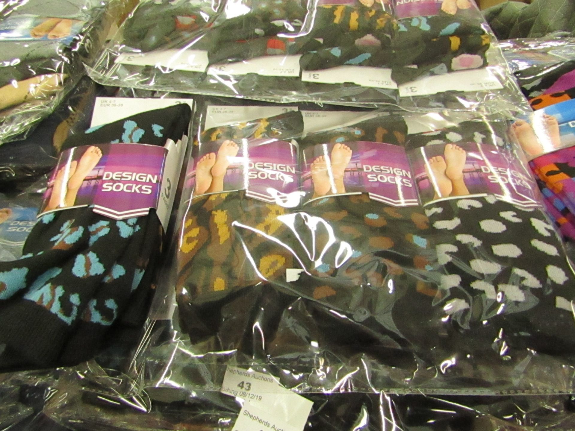 Pack of 12 pairs Mens Design Patterned Socks size 6-11 all new in packaging