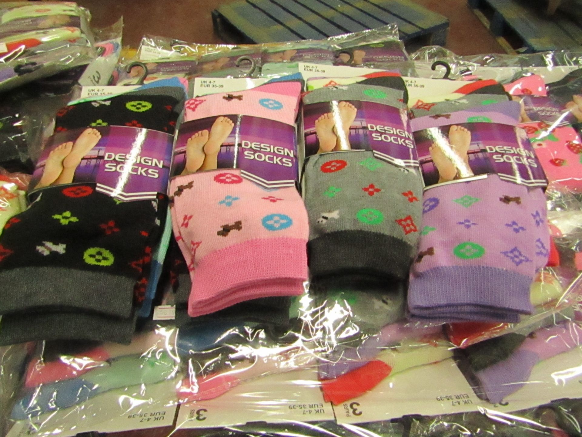 Pack of 12 x pairs Ladies Design Socks size 4-7 all new in packaging see image for design