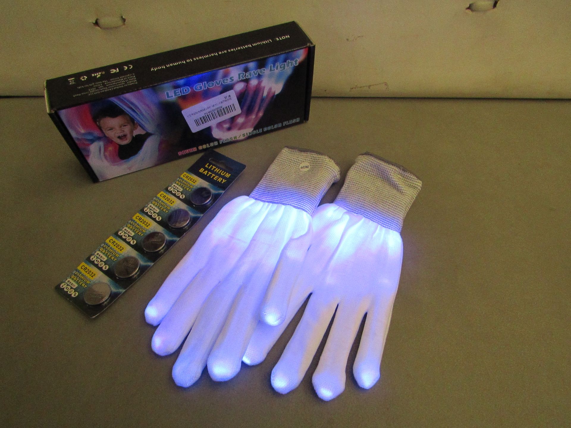 4 Pairs of LED Gloves Rave Light. Come with batteries plus Spare. Boxed. Ideal stocking fillers